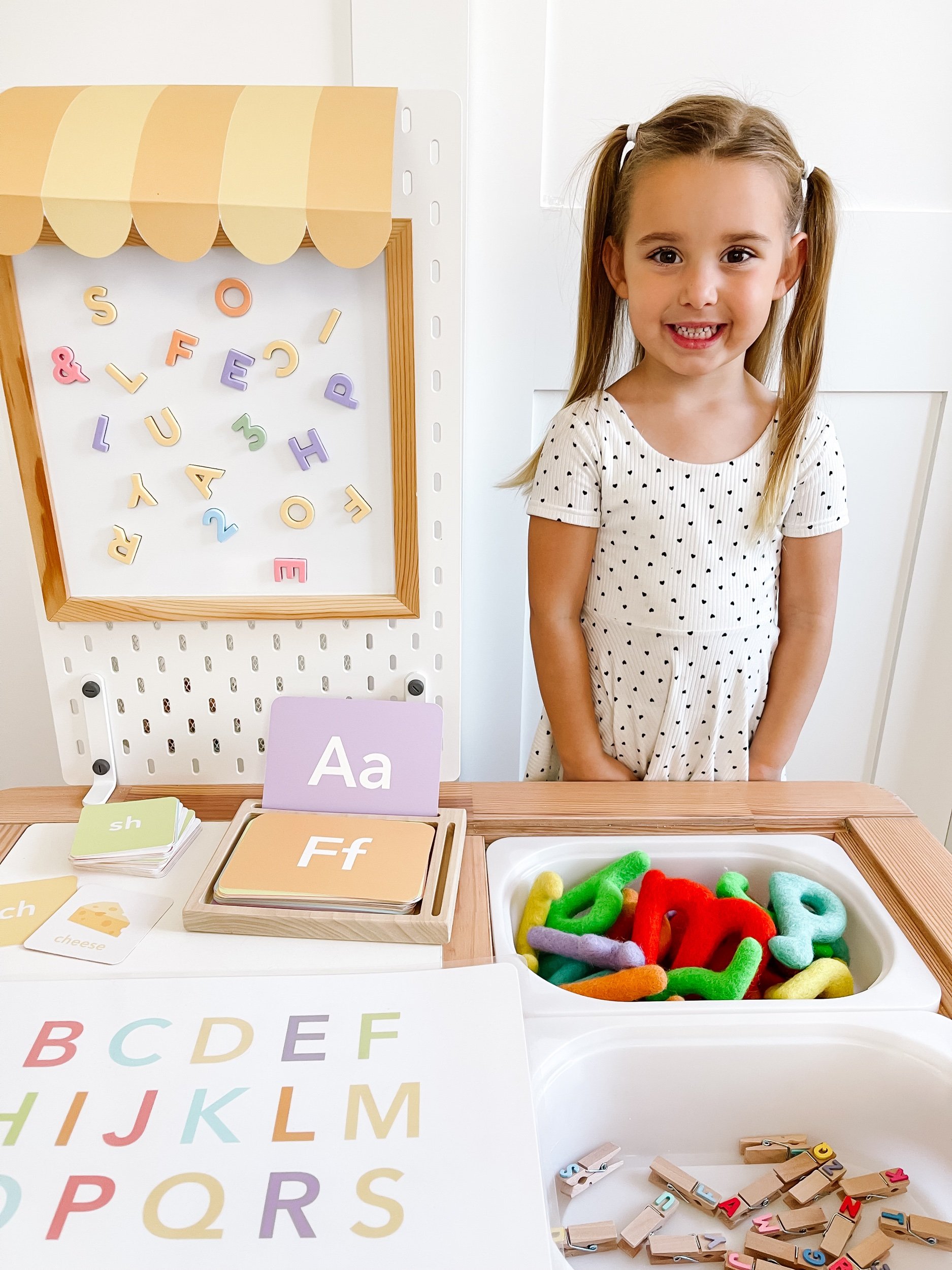 Toddler girl learning alphabet letter sounds
