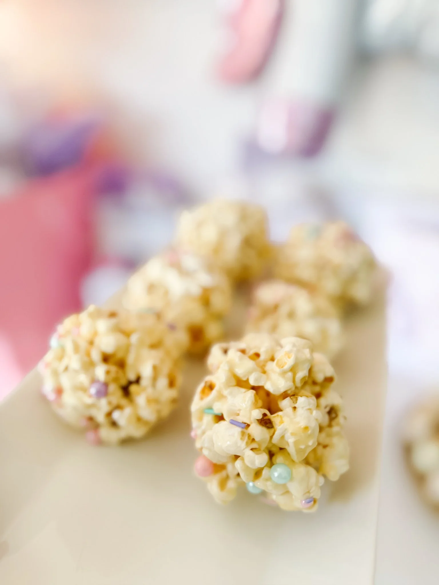 Bright pink unicorn sprinkle no bake popcorn balls