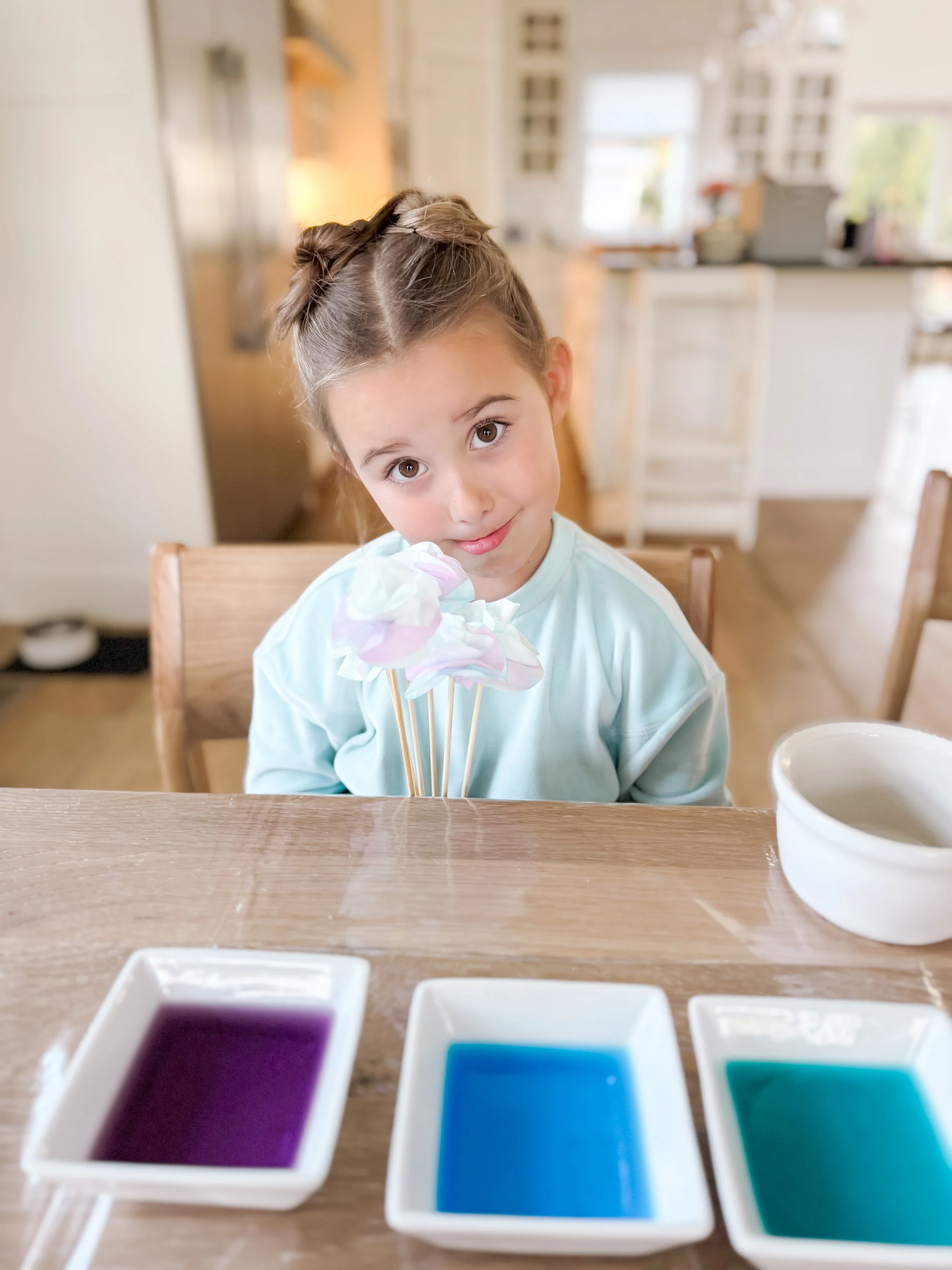  Finished coffee filter paper flowers bouquet in pastel rainbow colors made by toddlers, perfect for sensory play and homeschool Spring Week activities. 