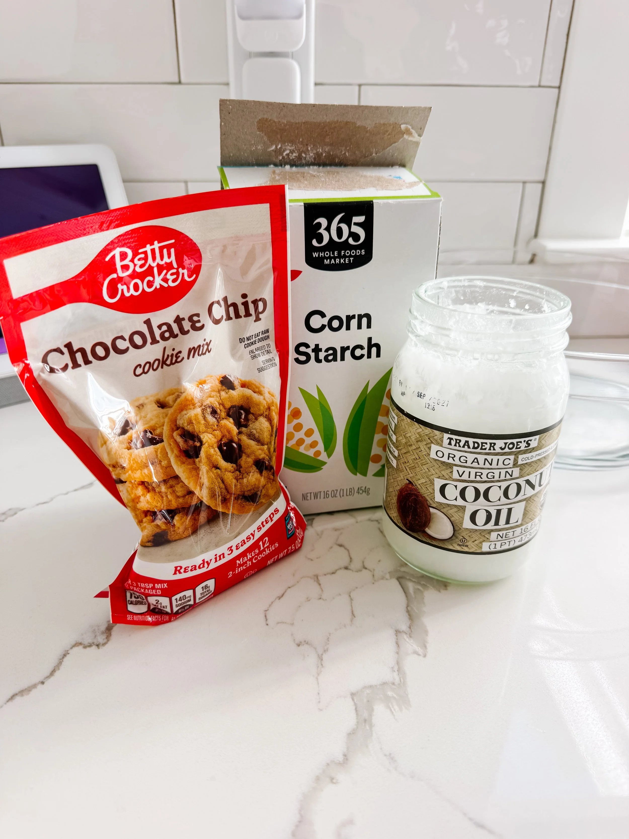 Cookie mix and cornstarch being combined for homemade ice cream play dough.