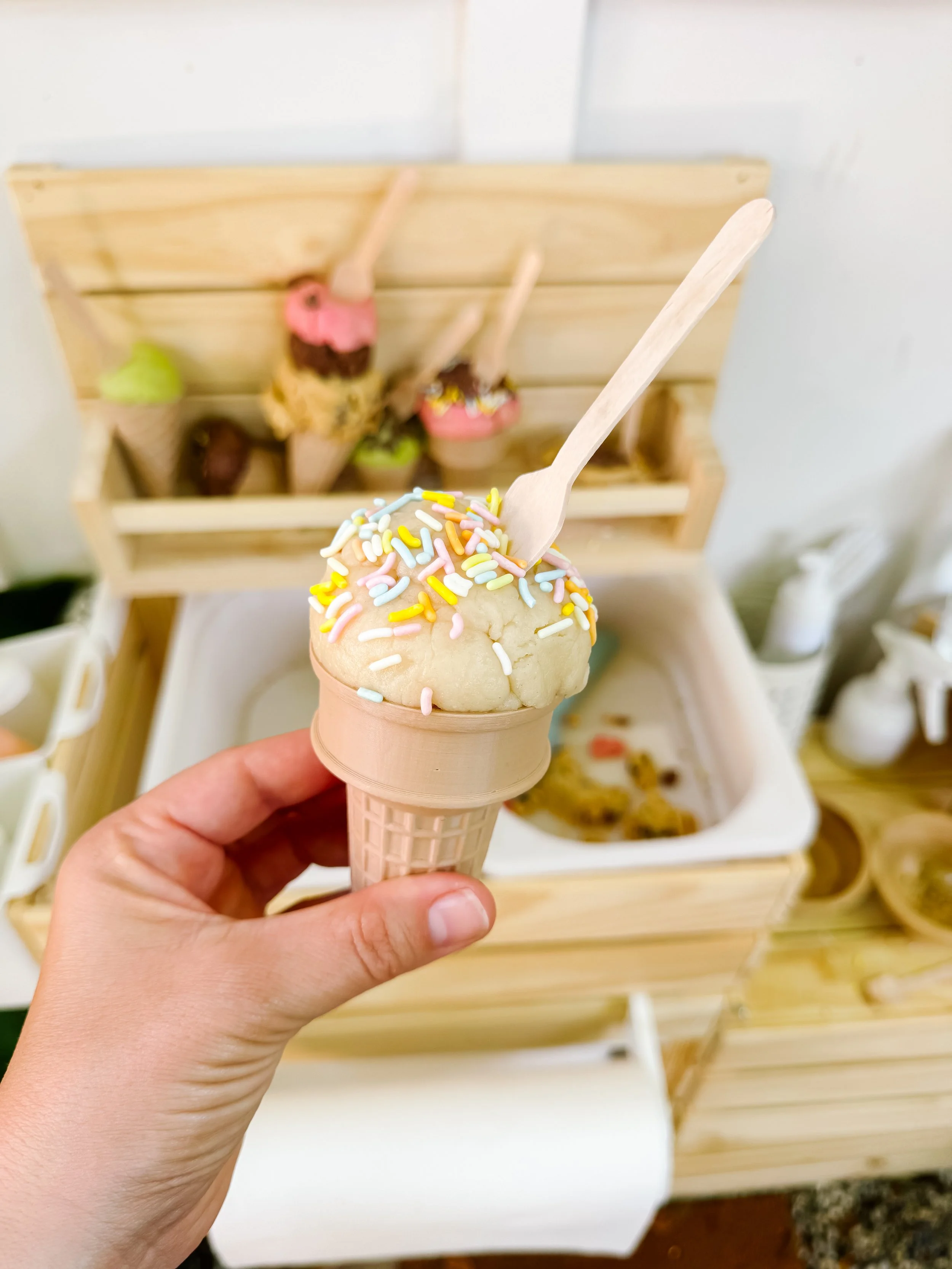 Different colors of homemade ice cream play dough for pretend ice cream shop play.