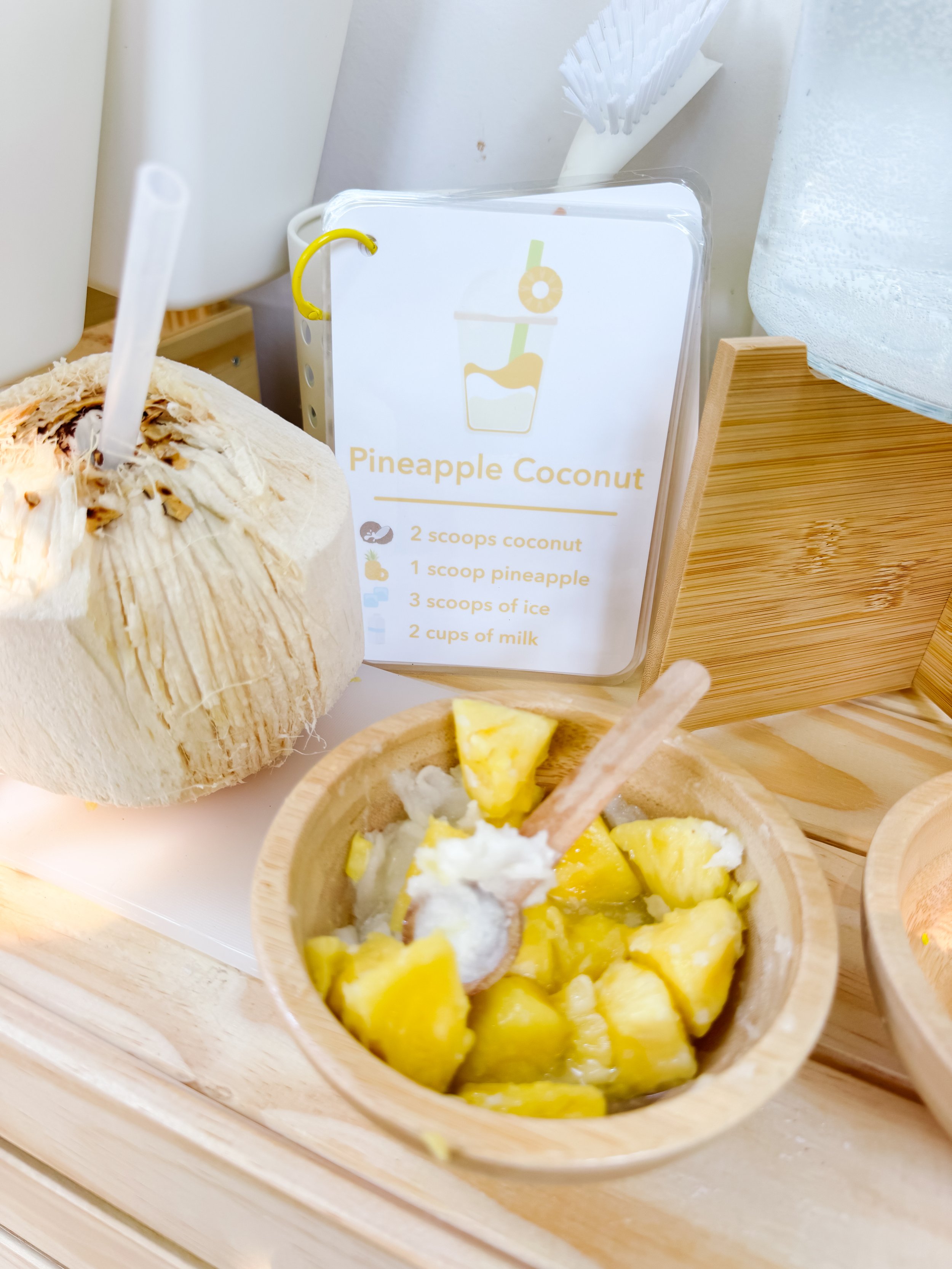 Pineapple coconut smoothie recipe card with ingredients for mud kitchen sensory play.