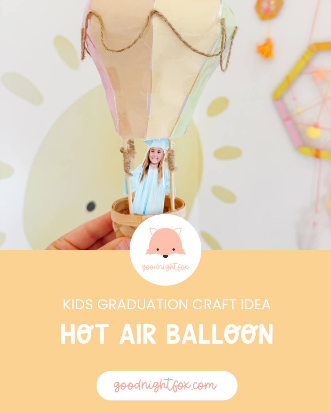 Hot air balloon graduation keepsake craft featuring a preschool graduate photo in a miniature woven basket beneath a pastel balloon.
