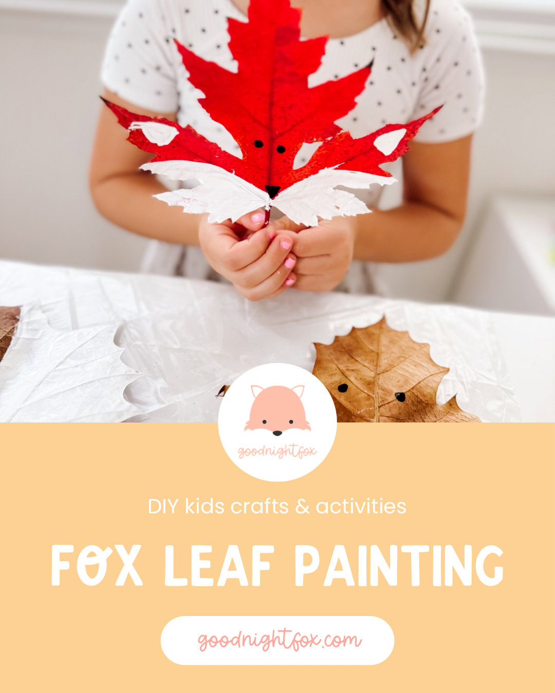 Leaf fox craft for kids made from a red maple leaf painted with white cheeks, black eyes, and a fox nose.