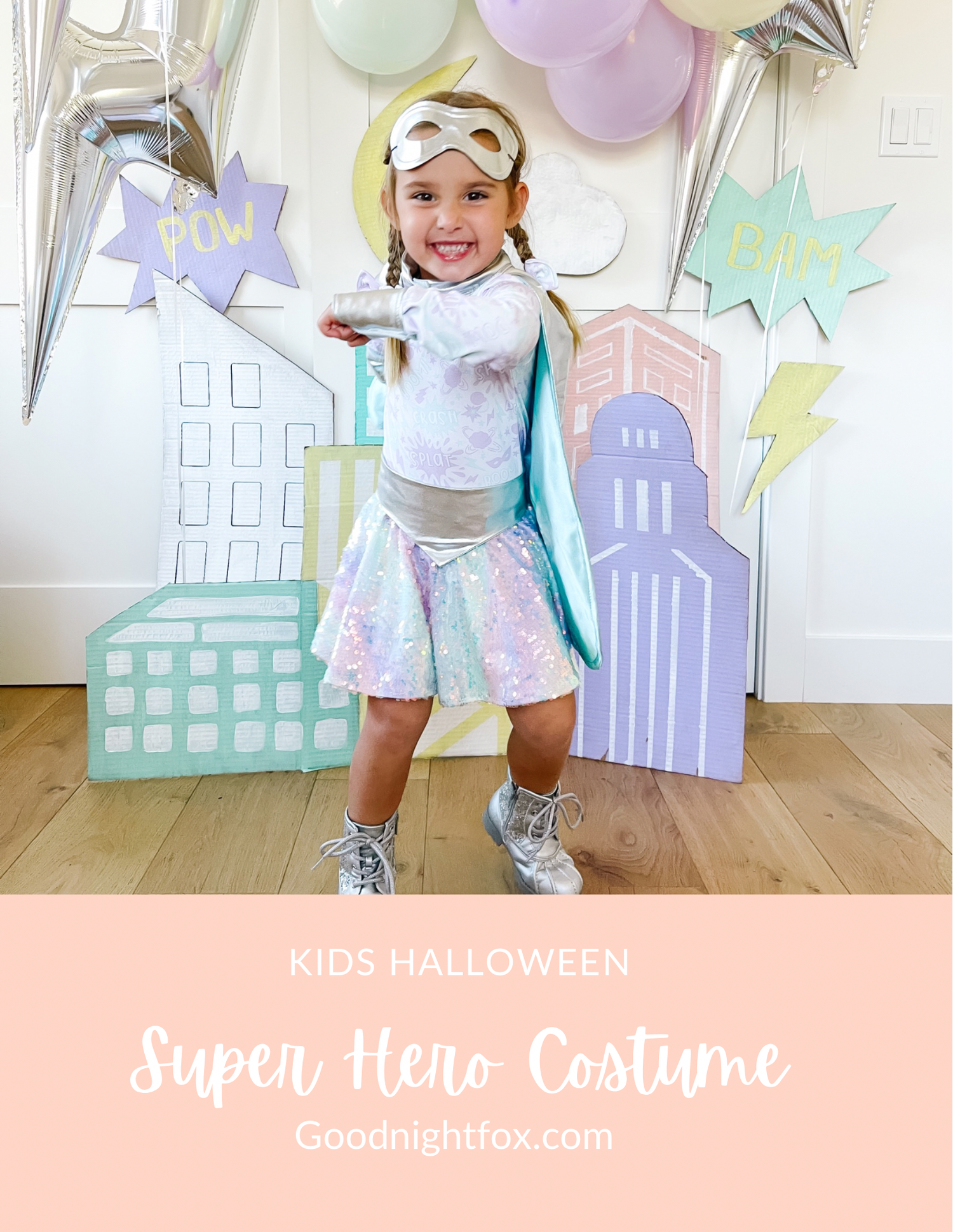 Handmade superhero costume with cape, mask and DIY cityscape backdrop