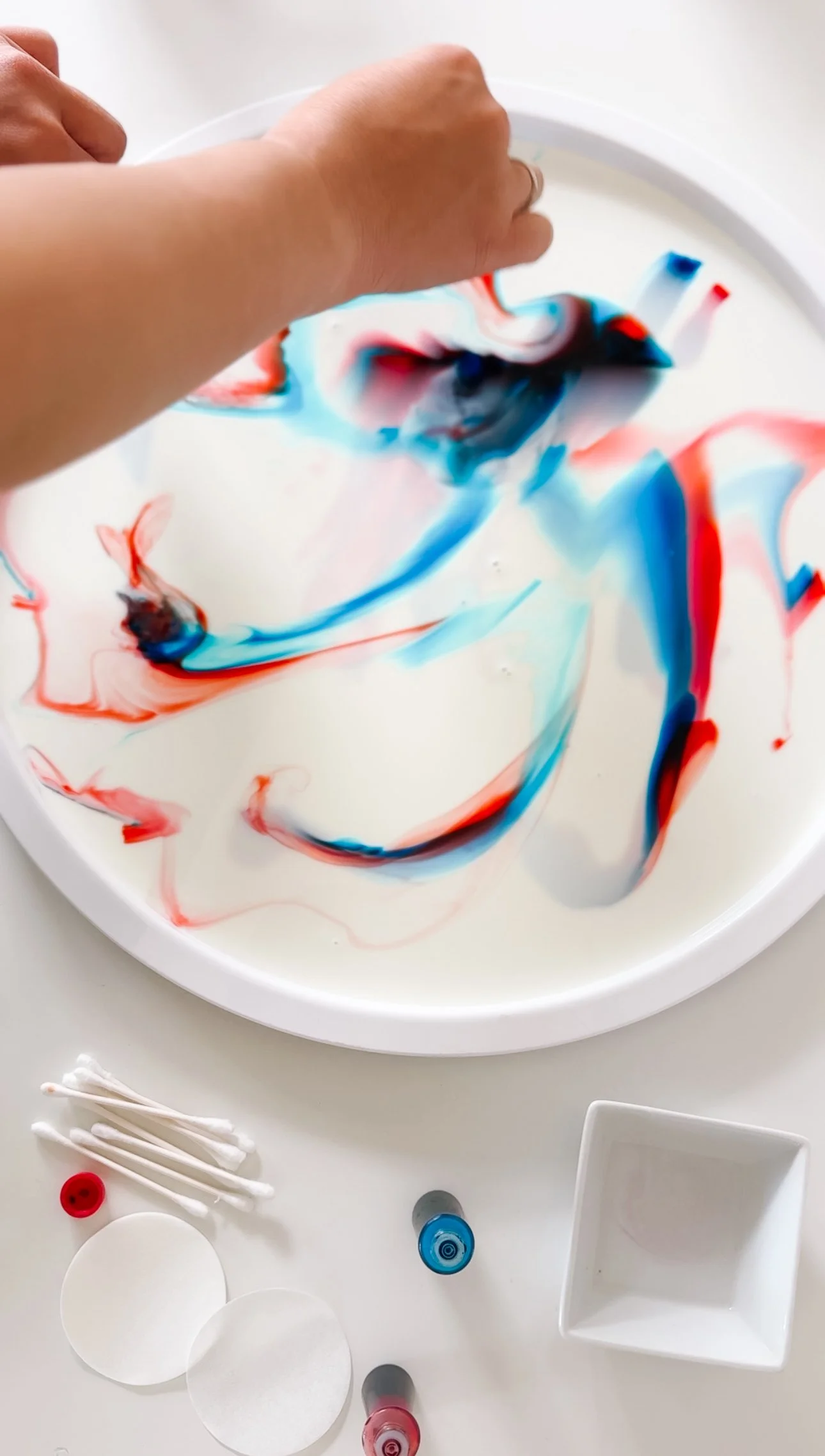 Red and blue food coloring added to a cotton makeup remover pad for a fireworks milk experiment.