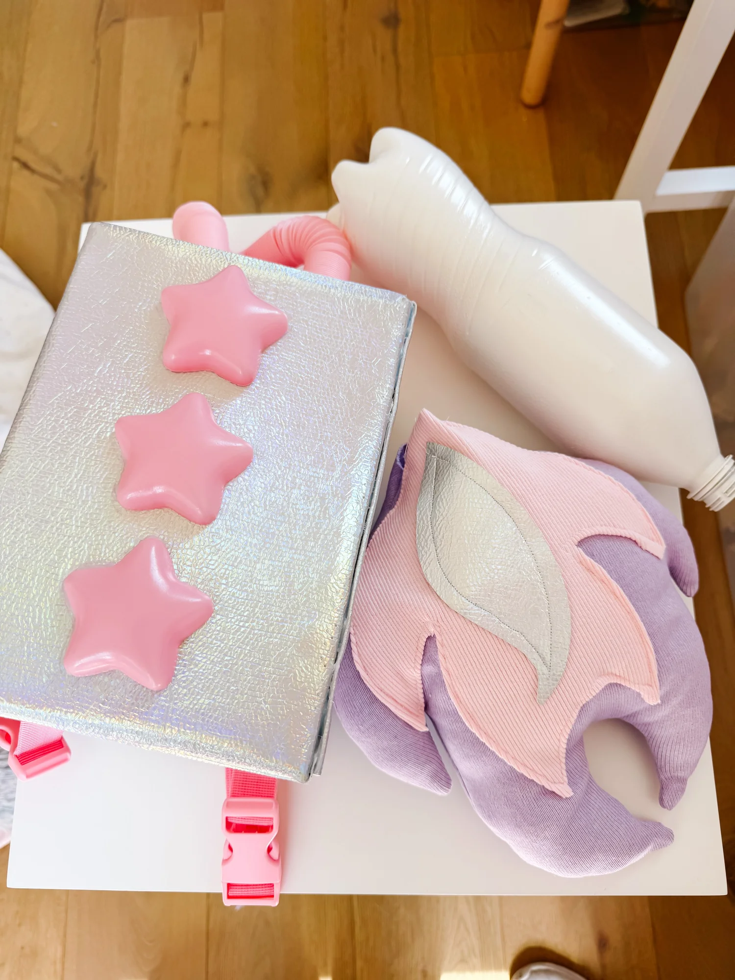 Jetpack base wrapped in silver fabric with pink straps