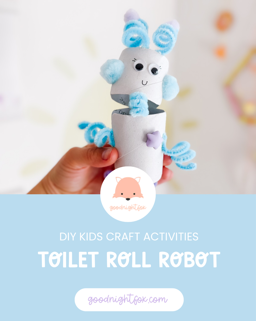 Finished toilet paper roll robot craft made with white cardboard tubes, blue and purple pipe cleaners, pom-poms, googly eyes, and building bricks.
