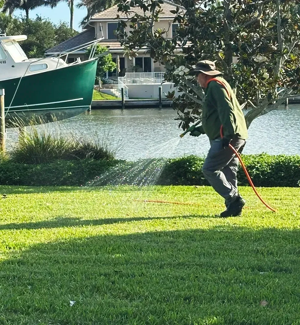 Clements technician treating a waterfront lawn in Sebastian FL