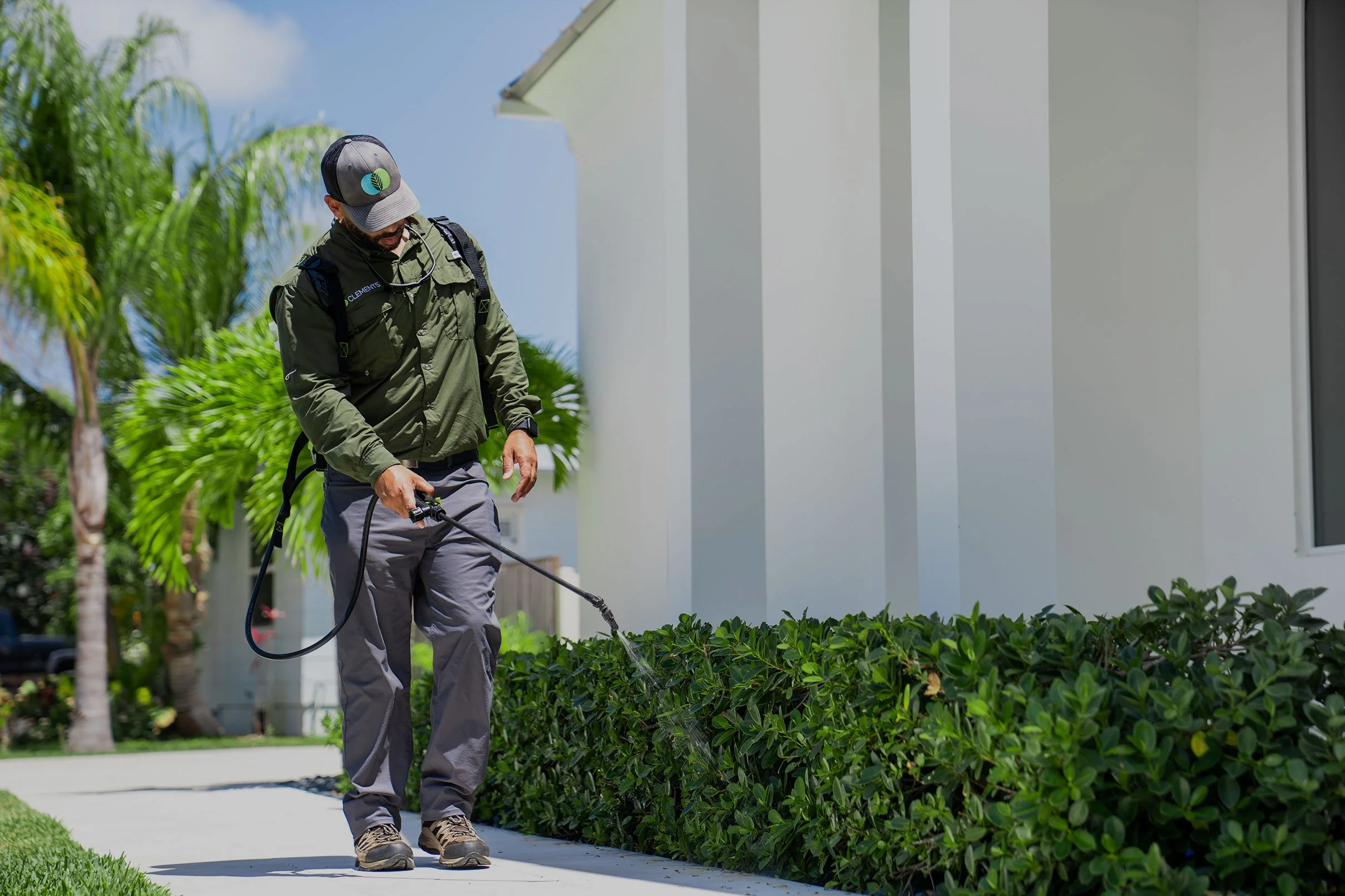 clements-pest-control-technician-near-treating-pests.jpg