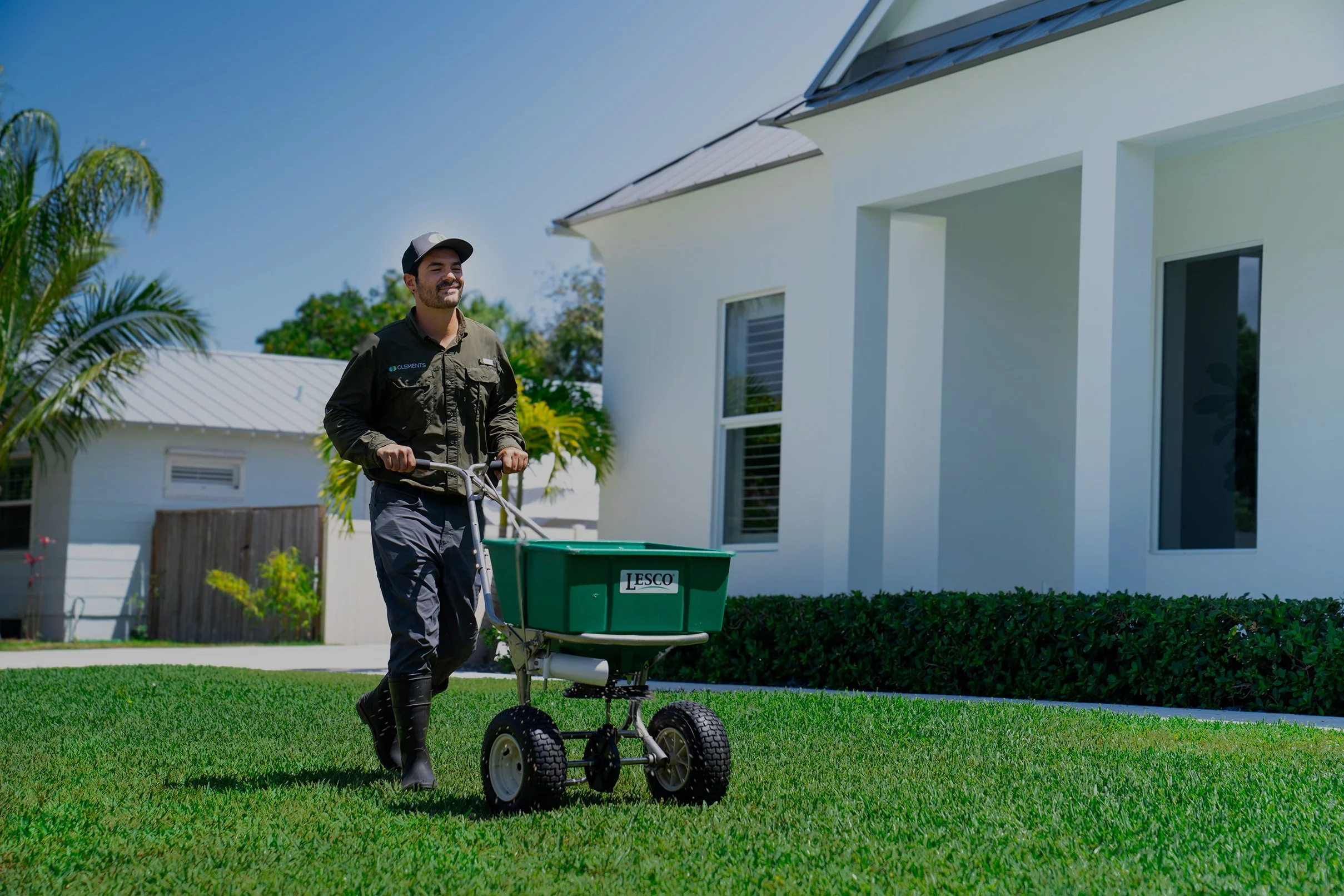 clements-lawn-care-technician-applying-grass-nutrients-2.jpg