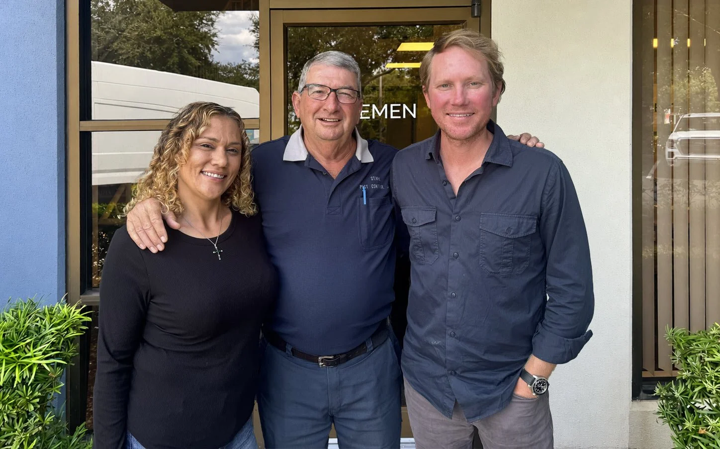 Cliff and Kristina Stahl with Chris Slade standing in front of building