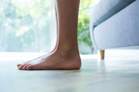 81867450_S_girl_woman_flat_feet_couch_indoor_window.jpg