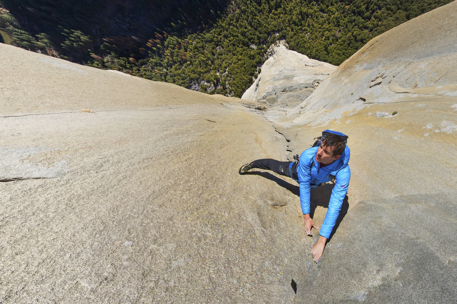 Alex Honnold on the Pankcake Flake. A granite flake as thin as a pancake was formed when the left side of the wall overlaps the right, creating perfect handholds. Explore here in 360. 
