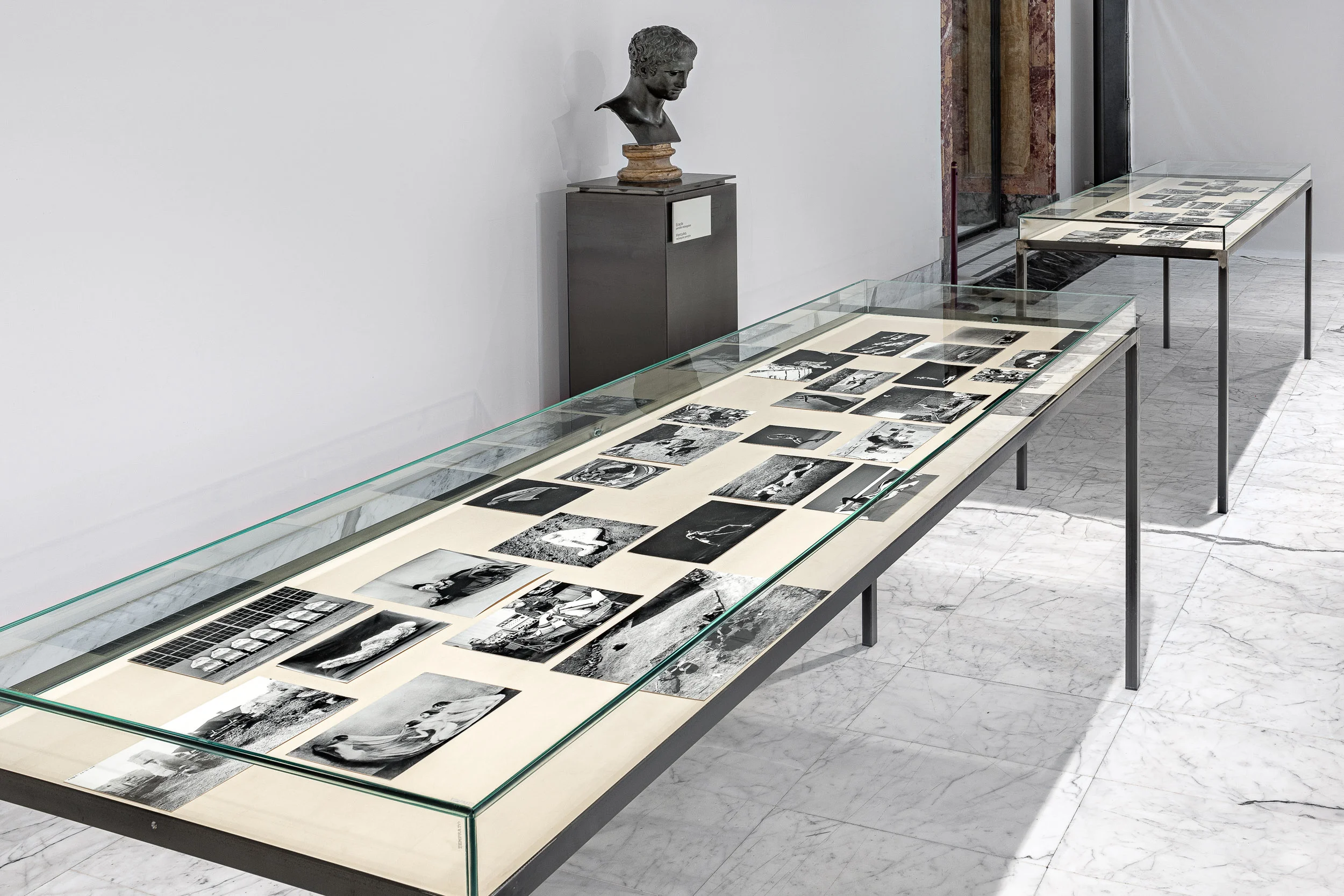Attitude 1 and Attitude 2 Steel and glass vitrine, black and white photographs, fabric 100 x 210 x 75 cm 2019