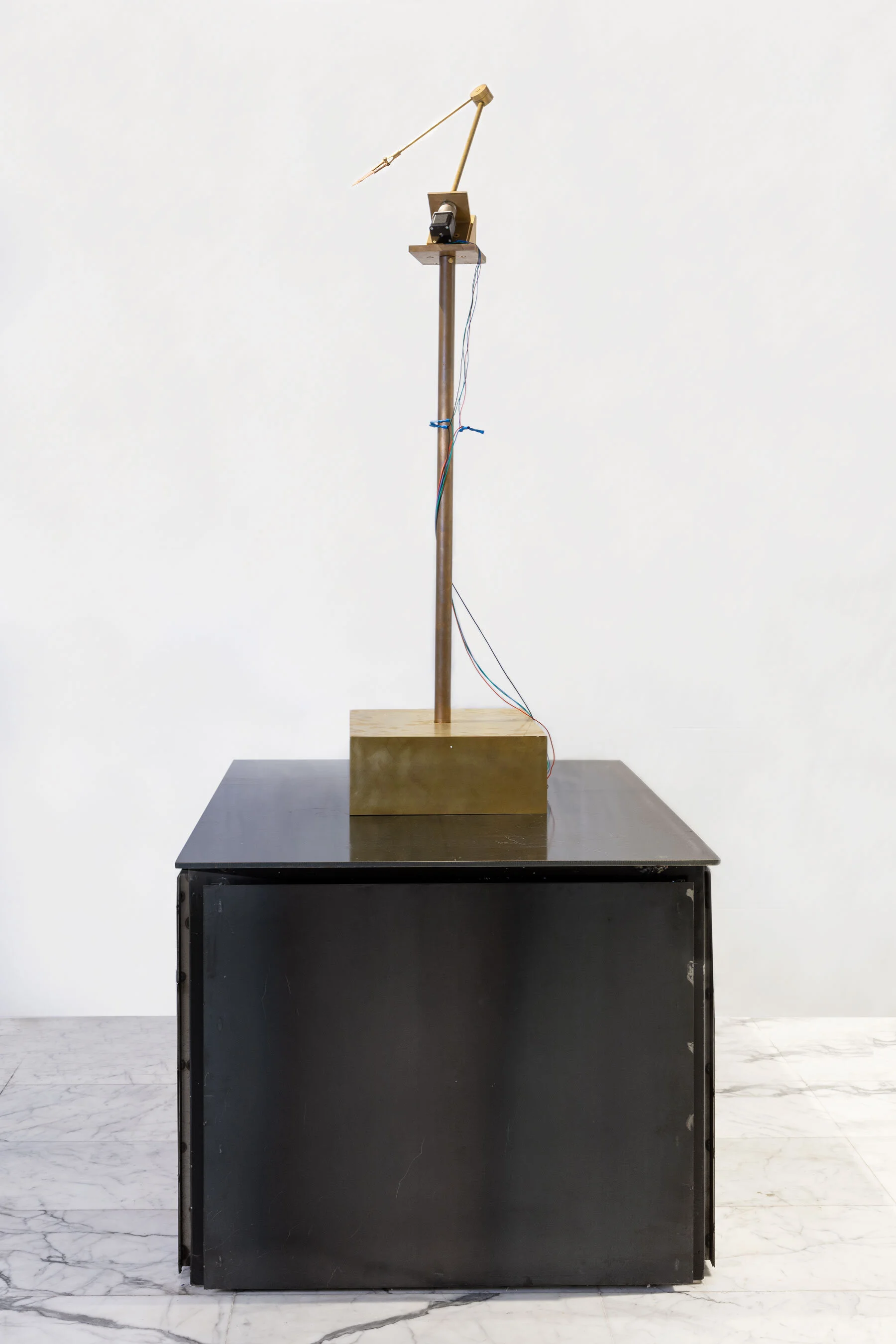 Atlas Brass, rotation motor, Neolithic Dalton point, electronics, wood 120 x 40 x 40 cm 2019