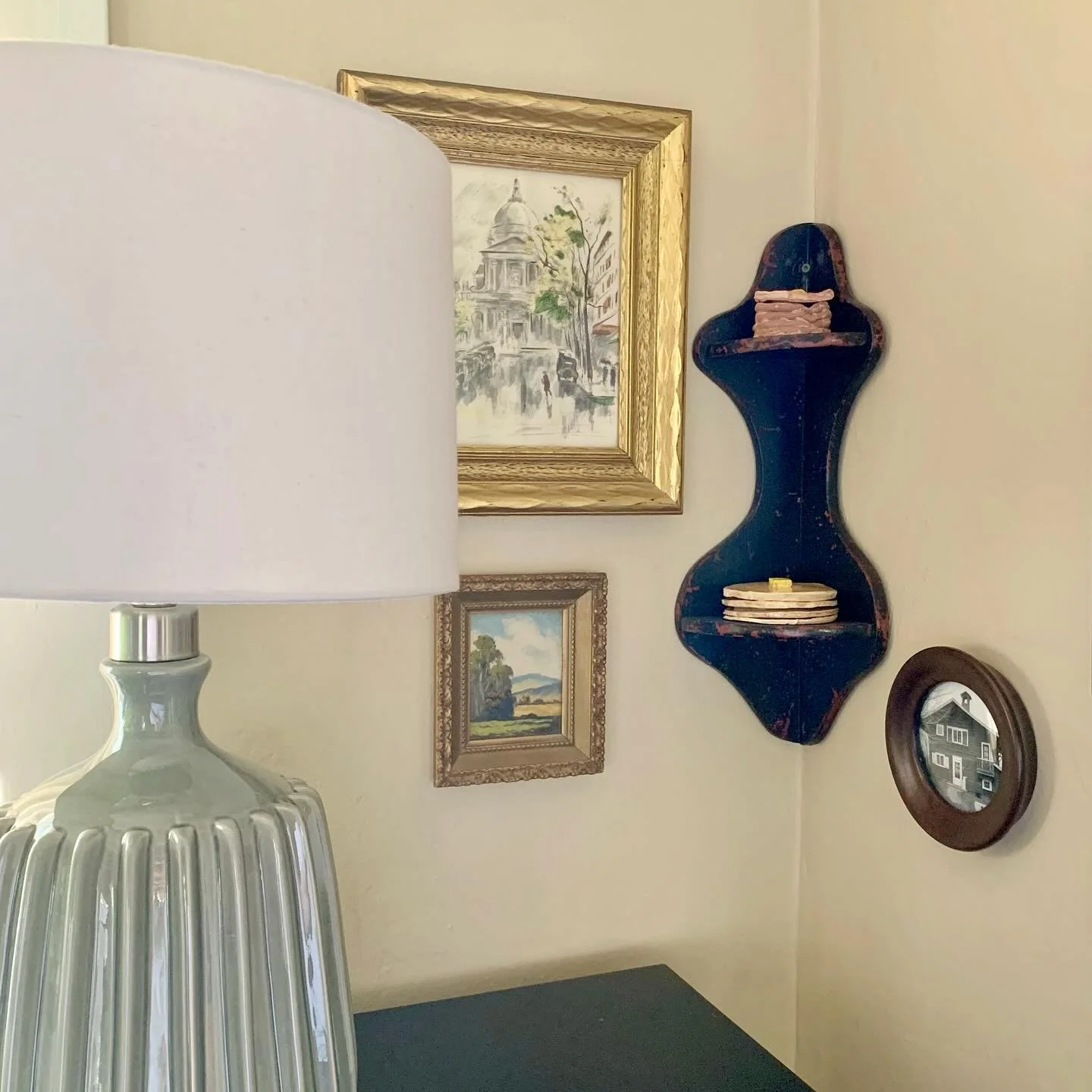 Hi friends Happy Saturday today I&rsquo;m sharing this corner of the Diningroom and it&rsquo;s thrifted magic. Sitting on a thrifted shelf you see not one but two stacks of pancakes - Art by my son. And these thrifted pieces of art in their gold fram