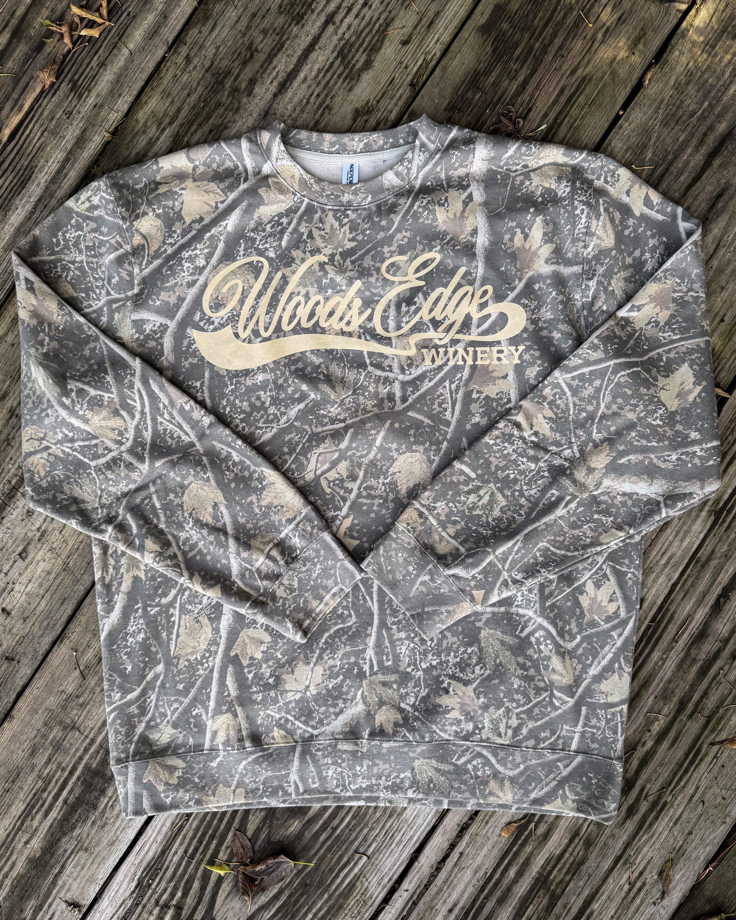 Woods Edge Winery design printed in Light Tan Vintage Wash on a Deadwood Tree camo crewneck.