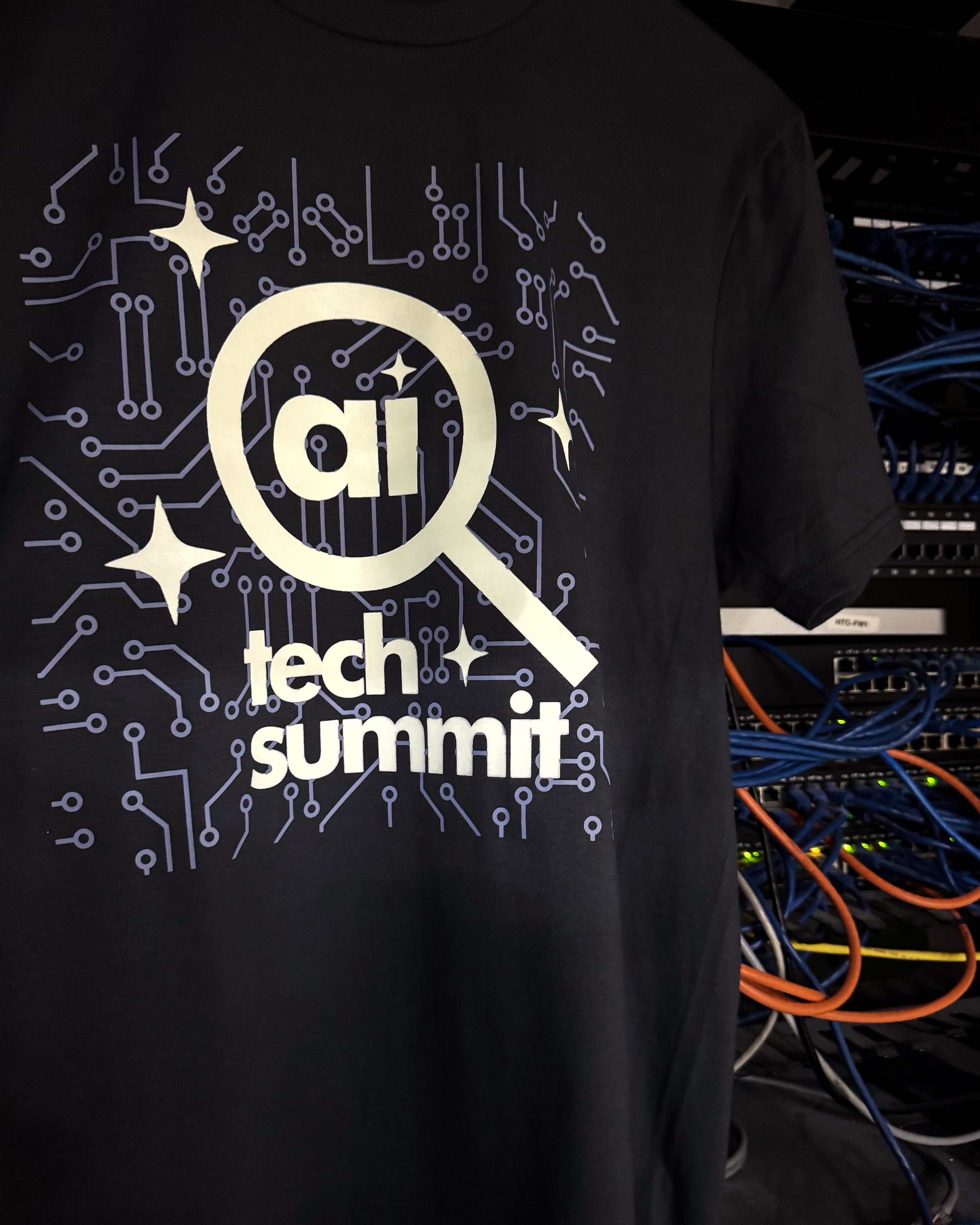 Luminous Glow in the Dark heat transfer on the District Very Important Tee DT6000, showcasing a modern tech conference graphic on a soft, lightweight tee.