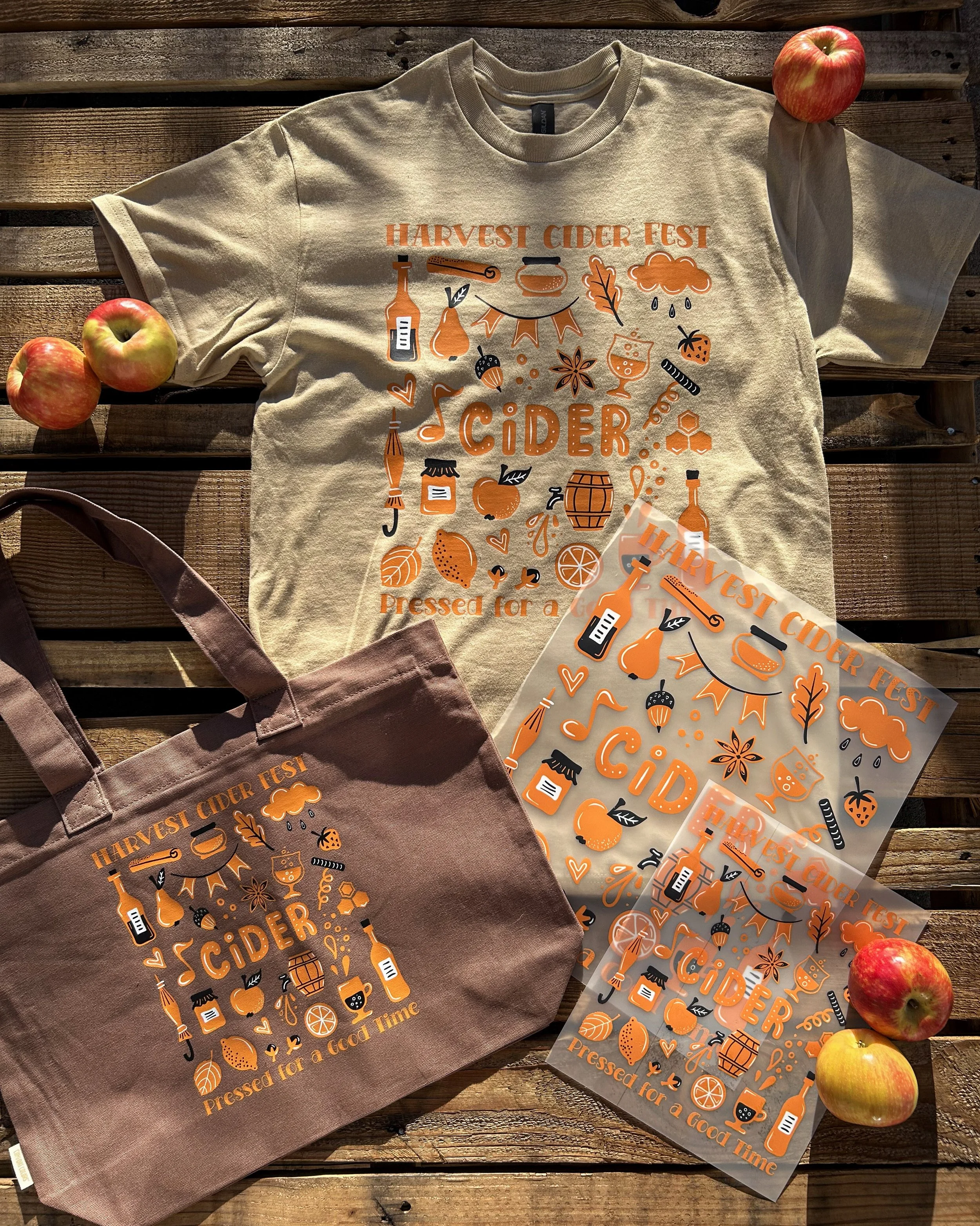 Tan Gildan tee and brown Comfort Colors tote printed with full-color Harvest Cider Fest artwork using colorVIBE DTF.
