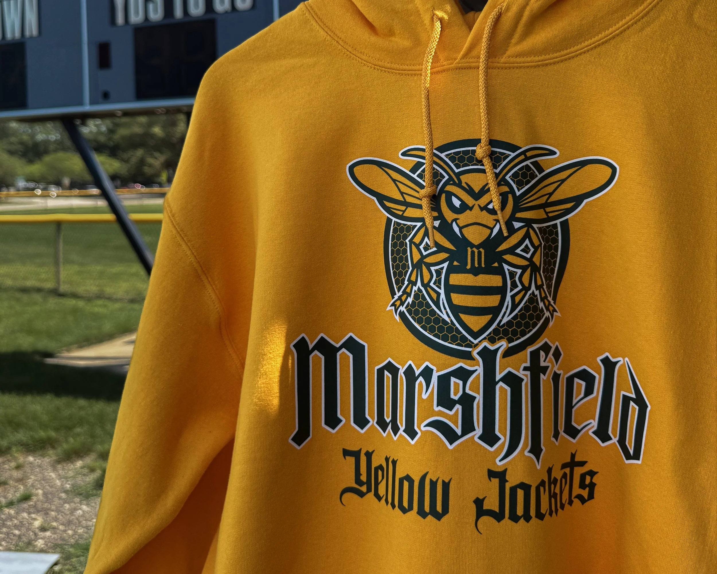 Athletic hoodie with school team logo applied using Howard Multi-Purpose screen printed heat transfers, showing durable full-coverage decoration on heavyweight fleece