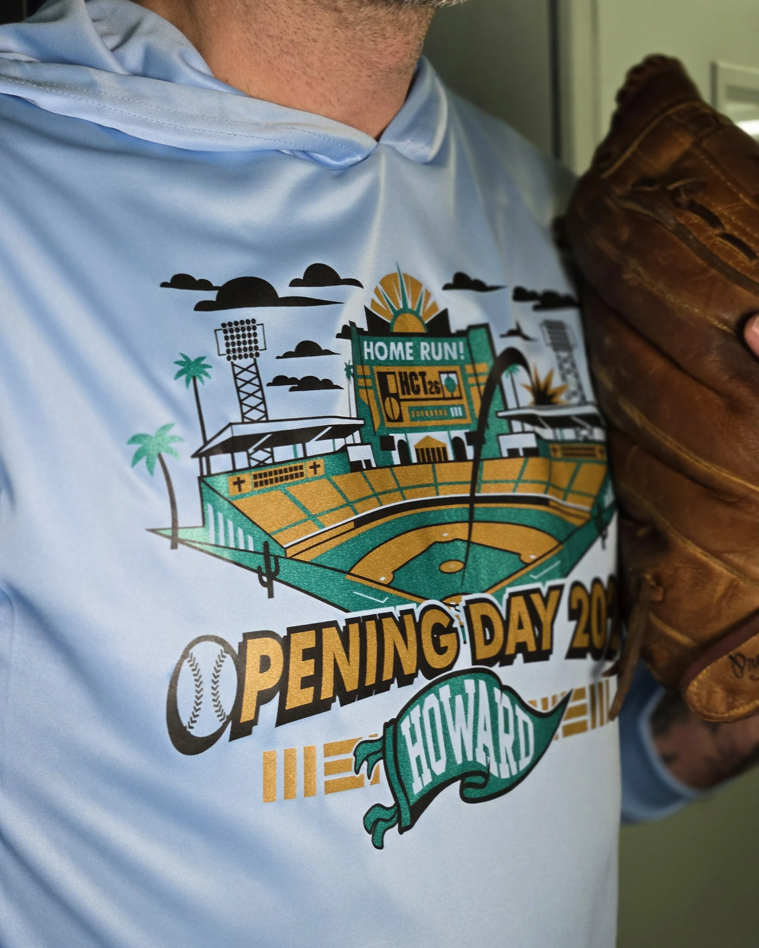 Shimmer on a performance tee, featuring a smooth metallic finish on a lightweight athletic shirt designed for breathability and movement.