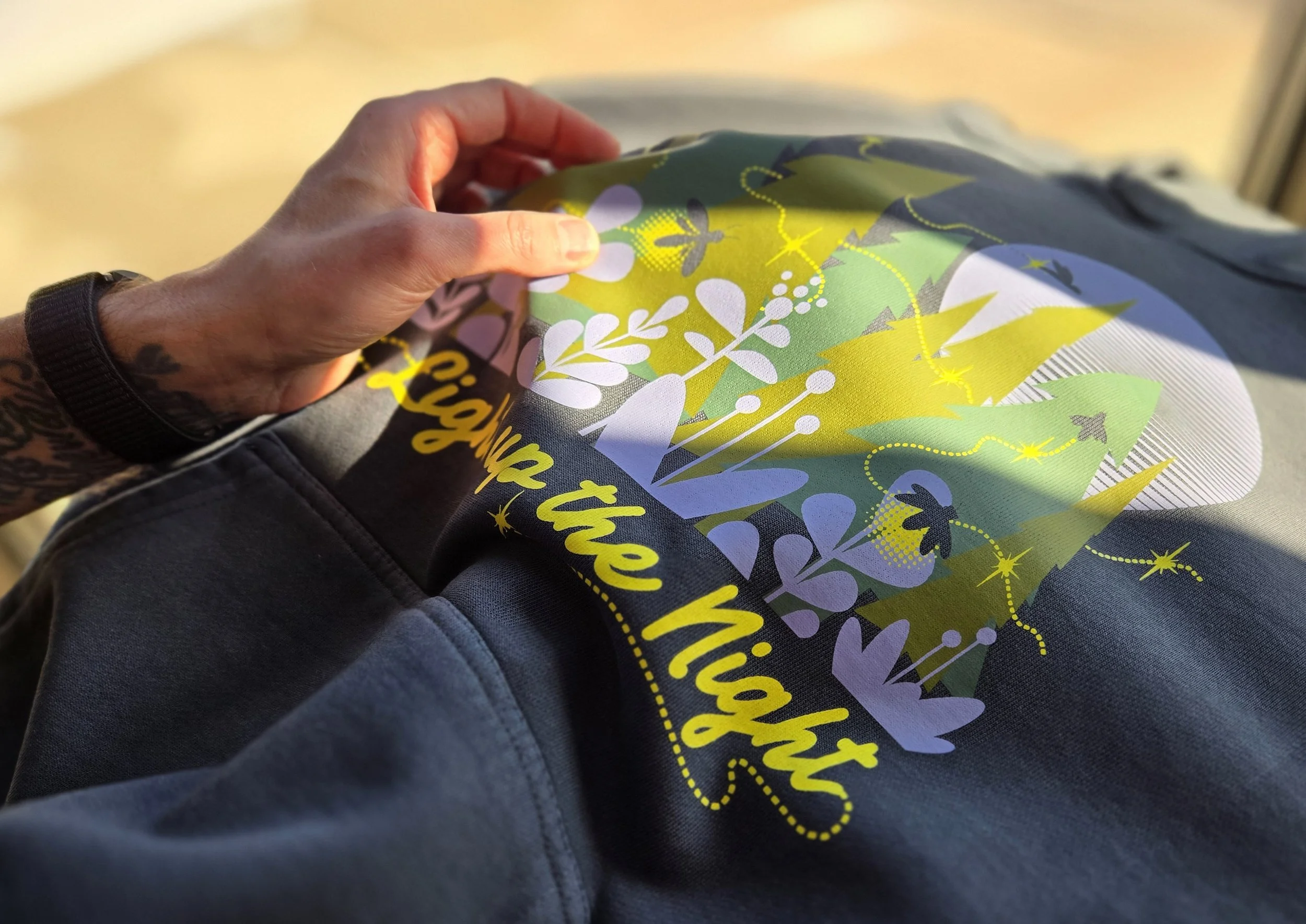 Glow in the Dark outdoor-inspired graphic on the Lane Seven LS16001GD Urban Hoodie Garment Dyed in Pigment Tornado, designed to light up the night with a natural, earthy aesthetic.