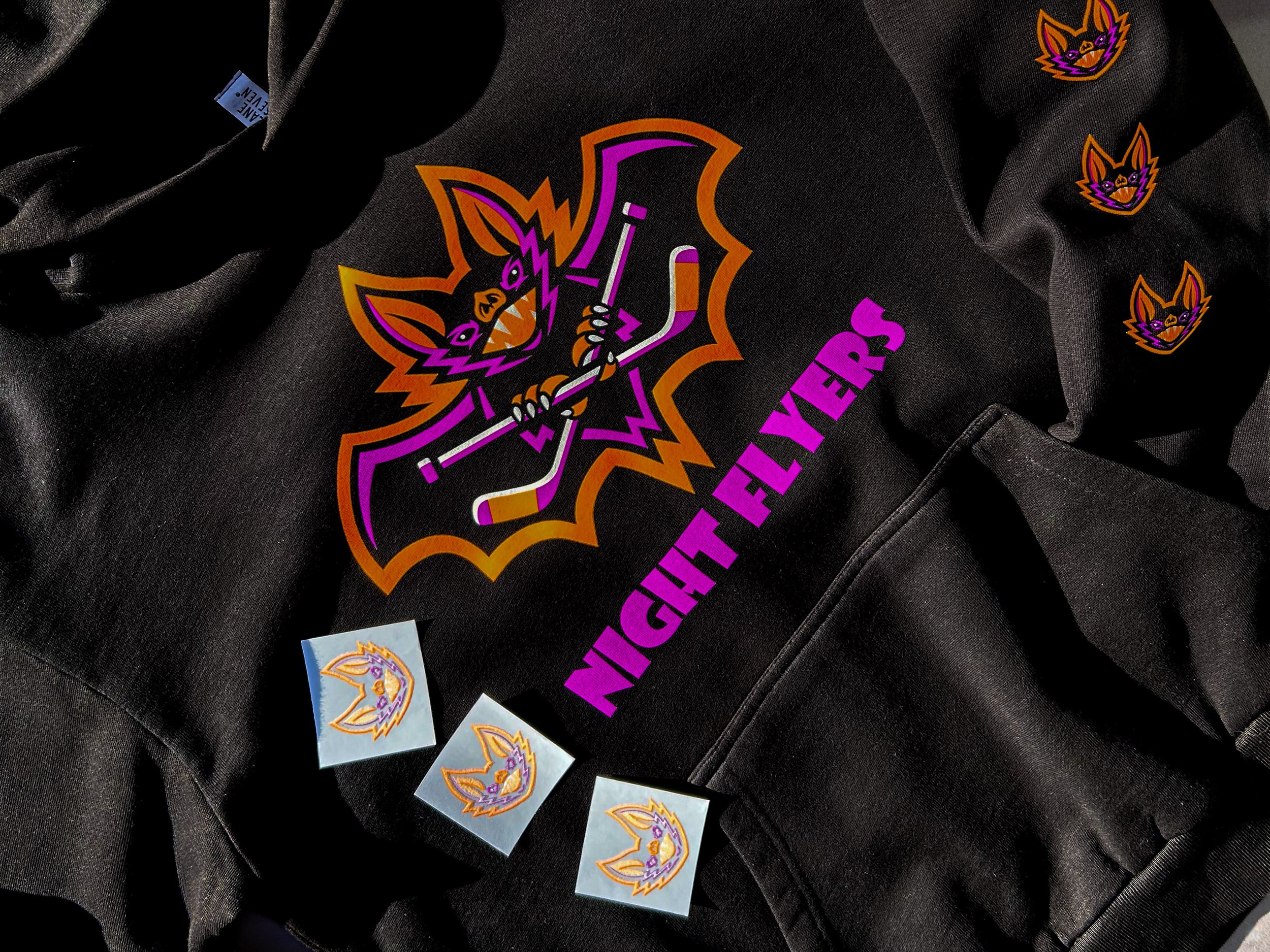 Black Night Flyers hockey hoodies printed with Neon Orange, Neon Purple and White Howard Multi-Purpose heat transfers.