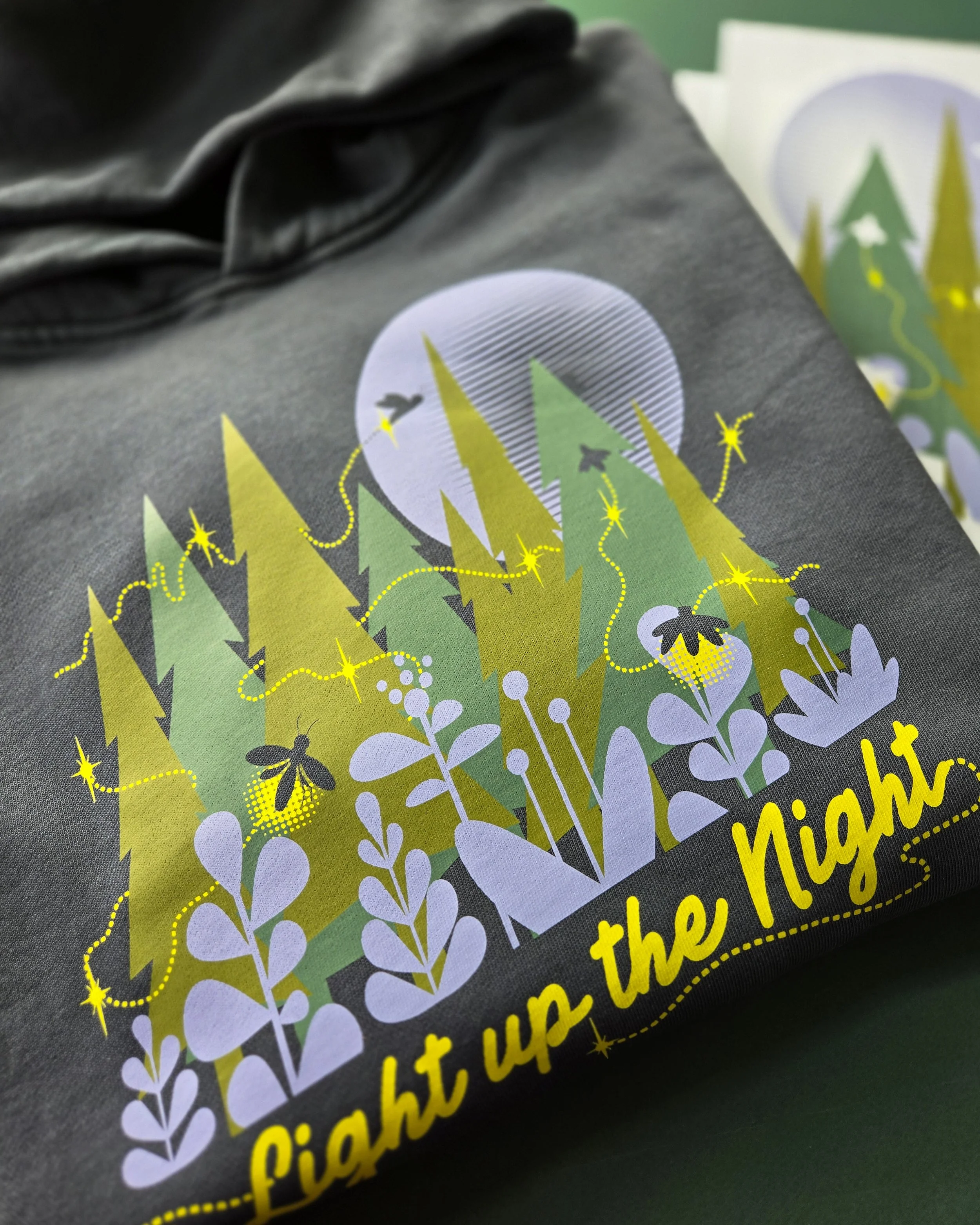 Glow in the Dark print on the Lane Seven LS16001GD Urban Hoodie Garment Dyed in Pigment Tornado, featuring a nature-inspired design that illuminates in low light.