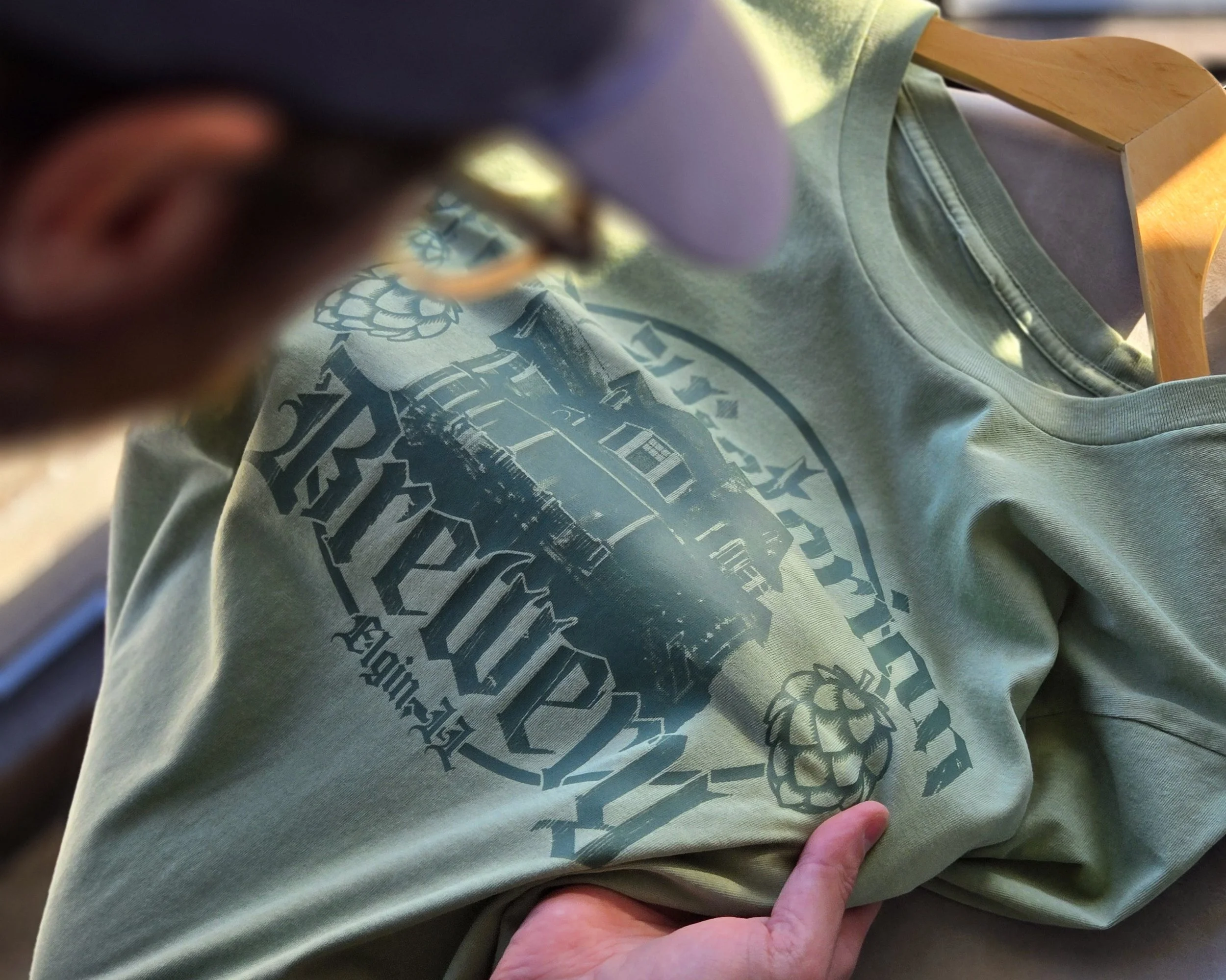 Printed garments displayed for customers to touch and experience, highlighting textures, designs, and finishes that encourage engagement and drive sales.