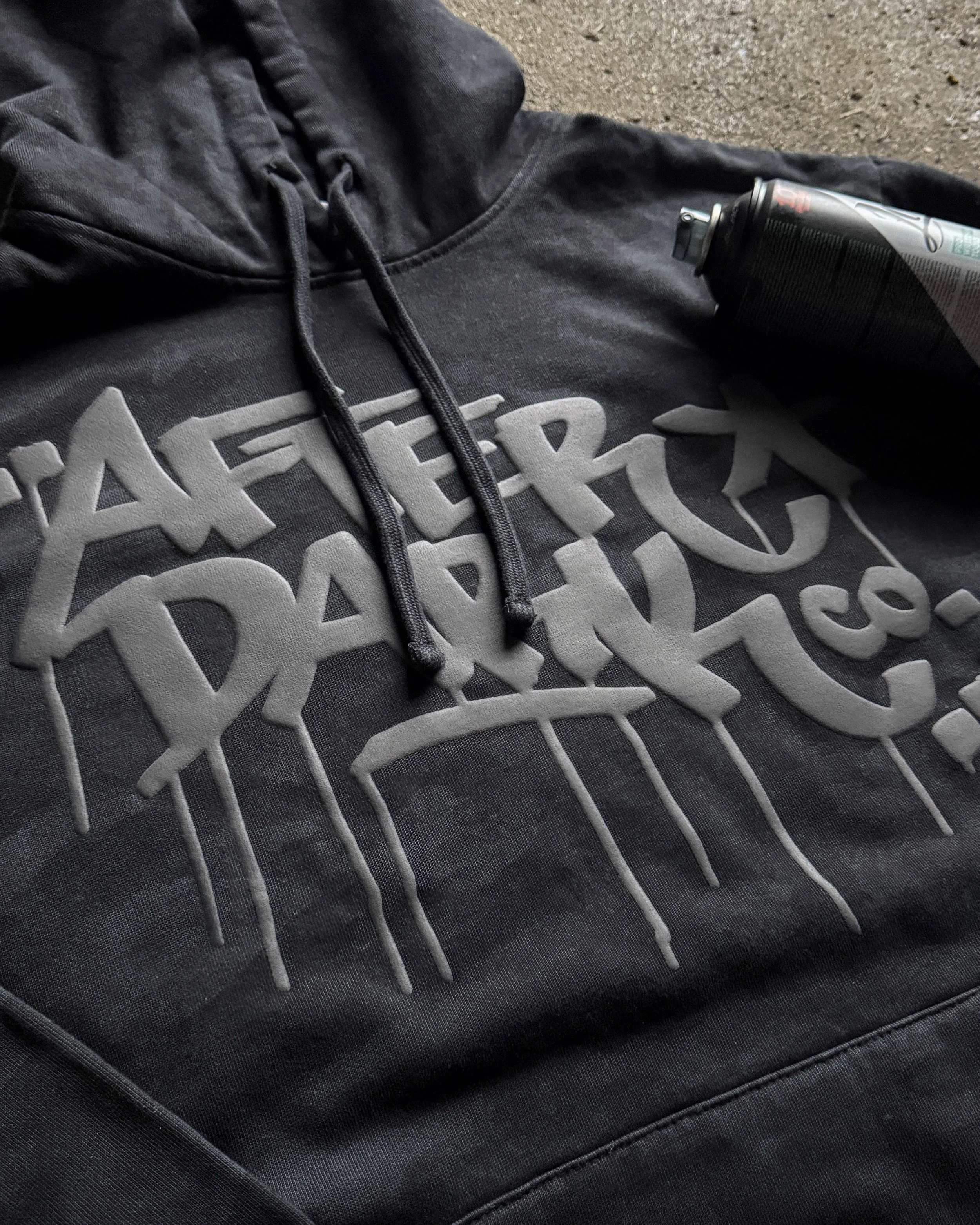 After Dark Co. design printed in Black Puff on a District Wash Camo Fleece Hoodie.