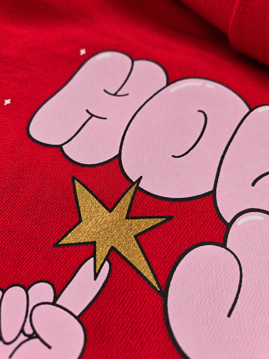 Close-up of five-color Howard Multi-Purpose holiday print on red fabric