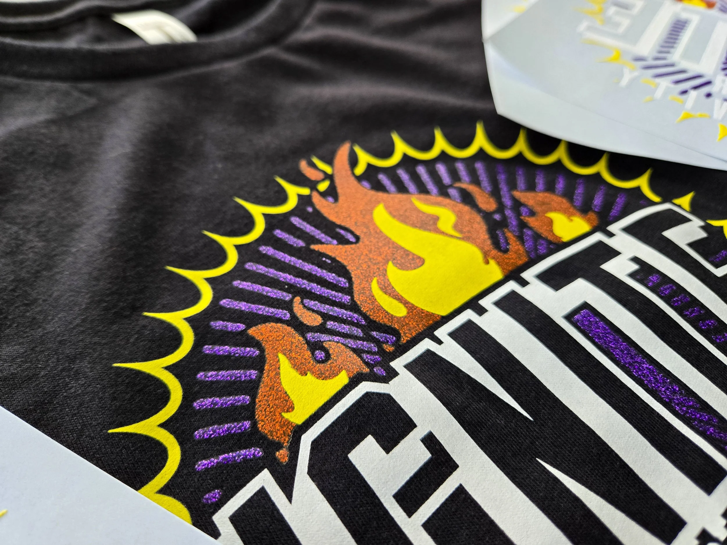 Glitter transfer print on a women’s cropped shirt, using the Next Level Apparel 1580 Women’s Ideal Crop Top