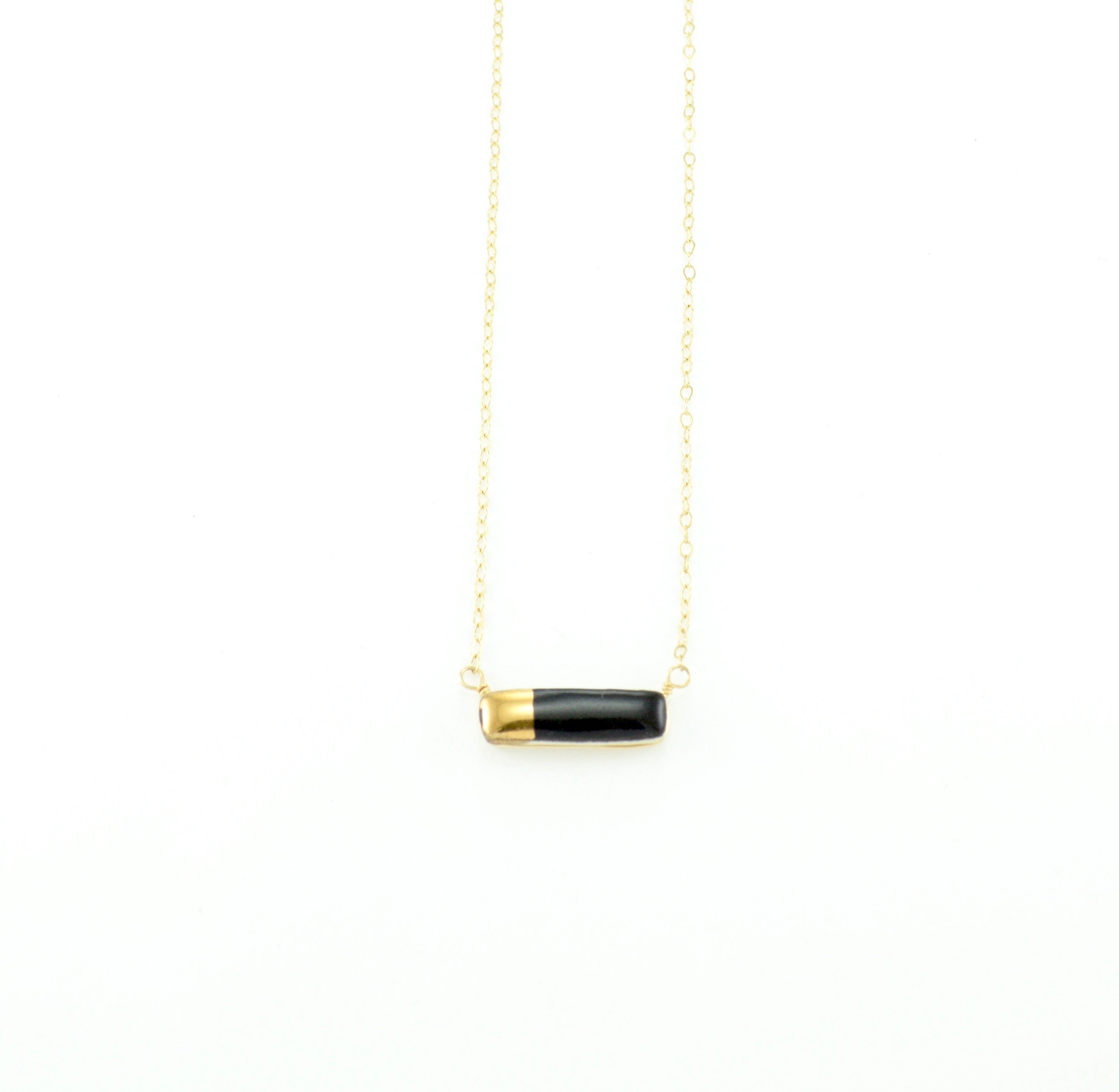 ZOË COMINGS teeny reed necklace black_gold half.jpeg