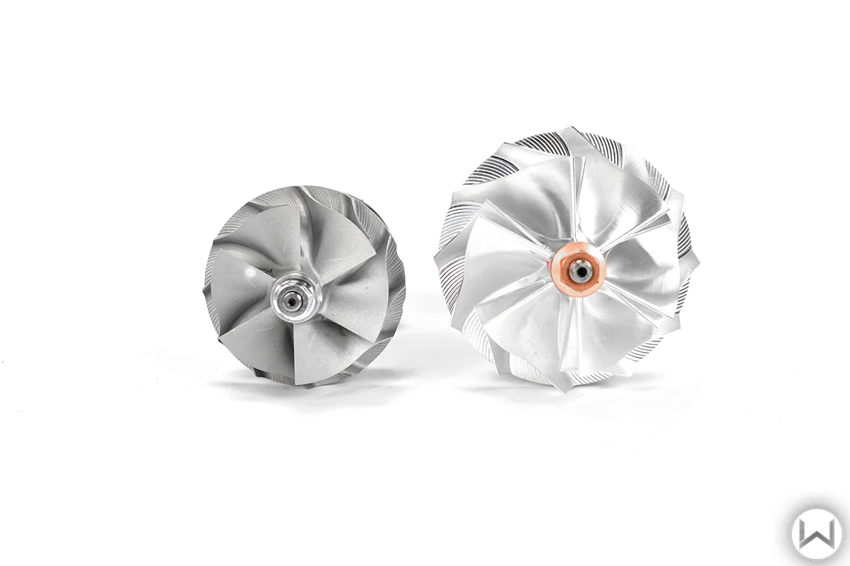 OEM compressor wheel left vs. 27WON Billet Upgraded compressor wheel on the right