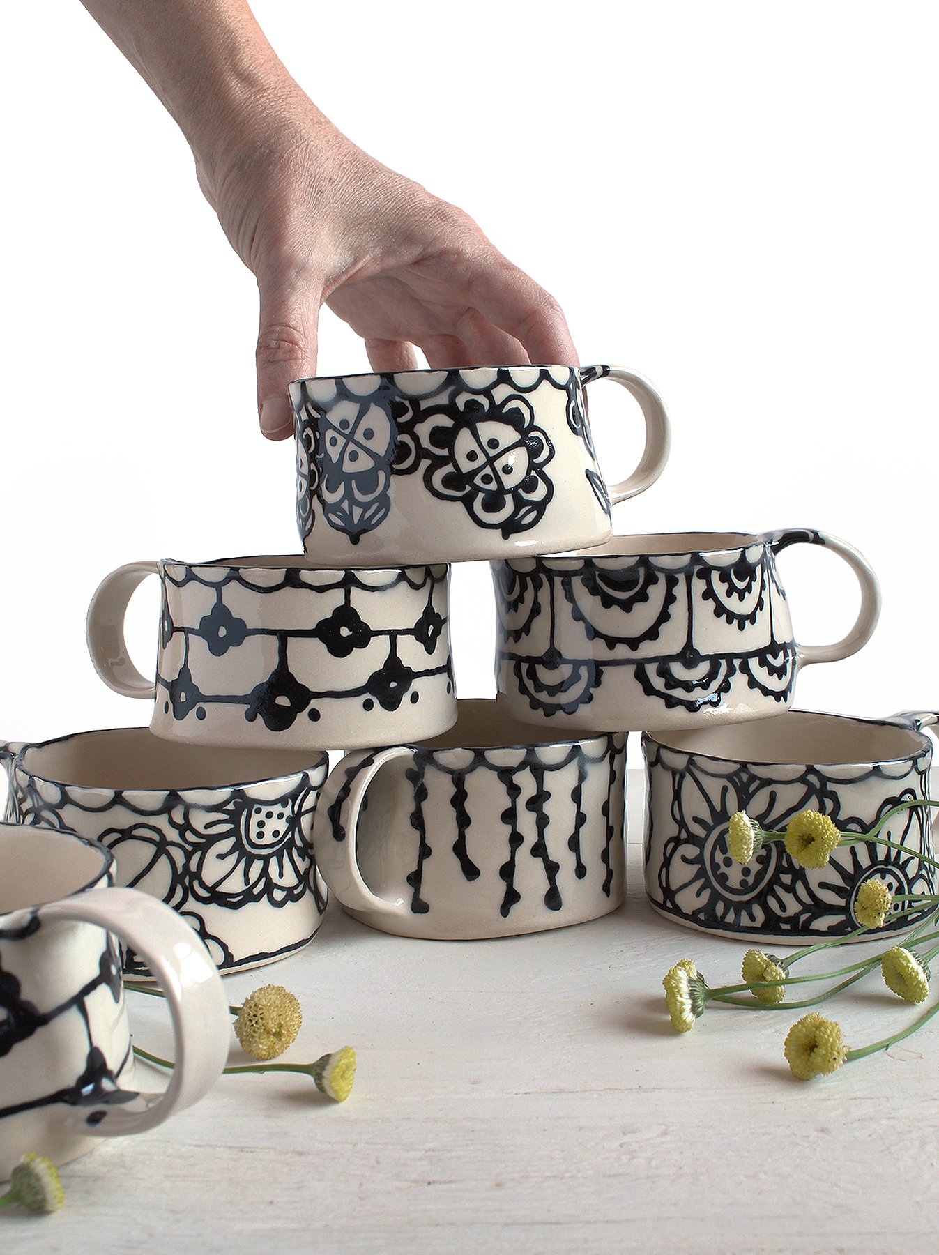 Barro by Lucrecia LACE Teacups stacked.jpg