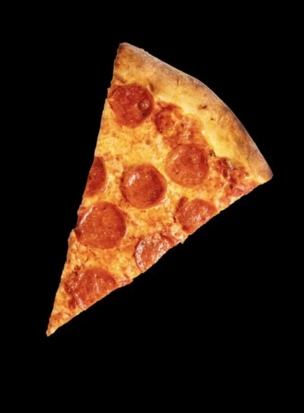 A slice of pepperoni pizza on a black background