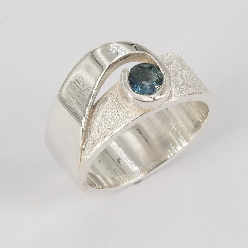 London blue topaz offset swish design sterling silver ring