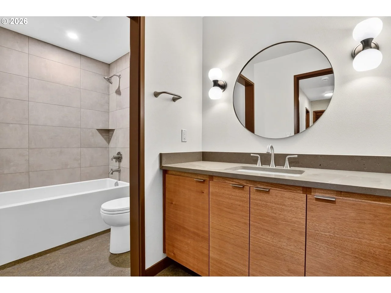 MID-CENTURY REBUILD - A 1973 Portland family home, renovated for resell, following intense winter storm damage. SCOPE: flooring, tile and countertop sourcing