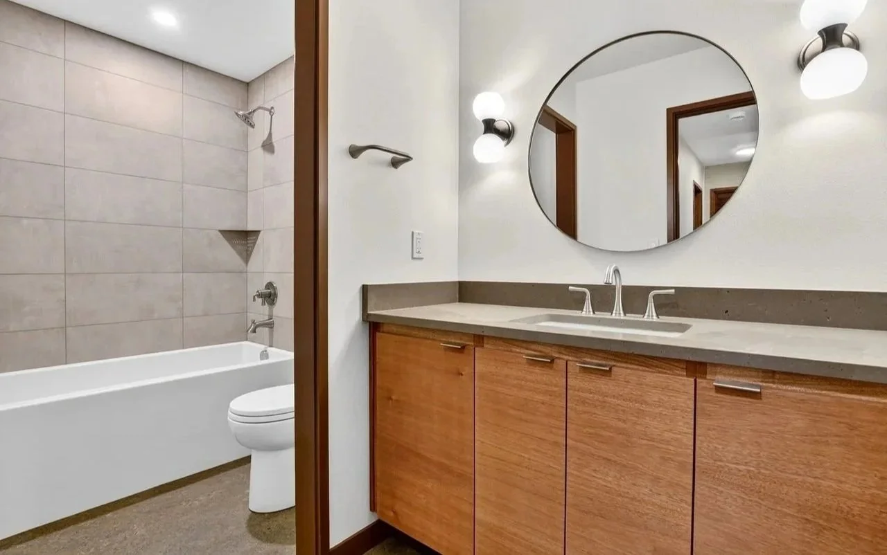 MID-CENTURY REBUILD - A 1973 Portland family home, renovated for resell, following intense winter storm damage. SCOPE: flooring, tile and countertop sourcing