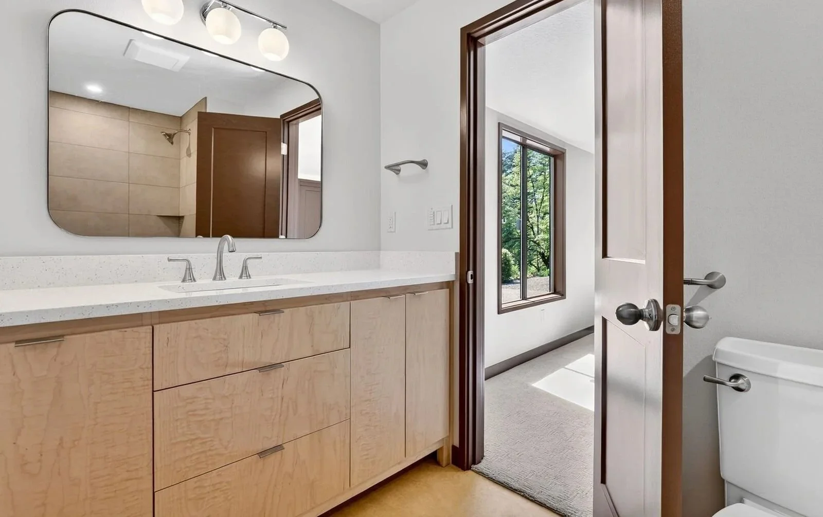 MID-CENTURY REBUILD - A 1973 Portland family home, renovated for resell, following intense winter storm damage. SCOPE: flooring, tile and countertop sourcing