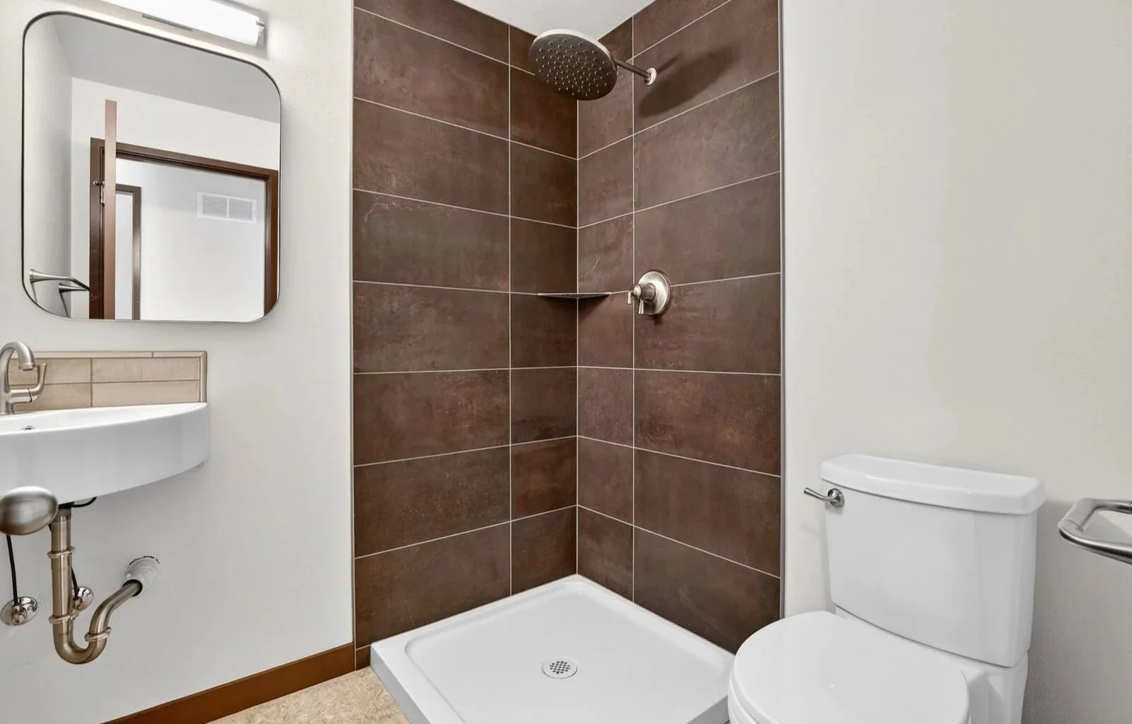 MID-CENTURY REBUILD - A 1973 Portland family home, renovated for resell, following intense winter storm damage. SCOPE: flooring, tile and countertop sourcing