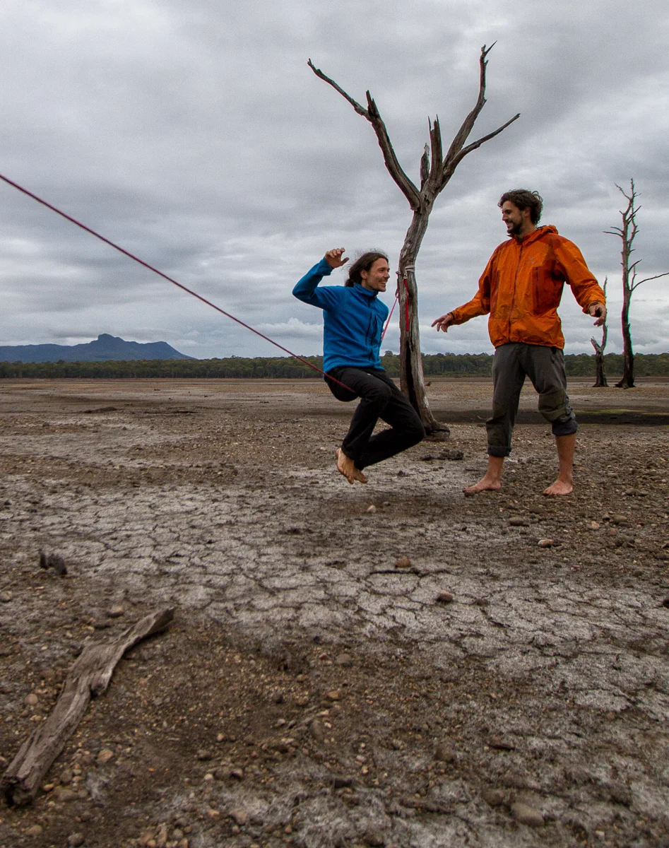 Even photographers can learn how to slackline, Stepan giving Kamil Sustiak a few pointers on a dry lakebed in Tasmania. Simon Madden
