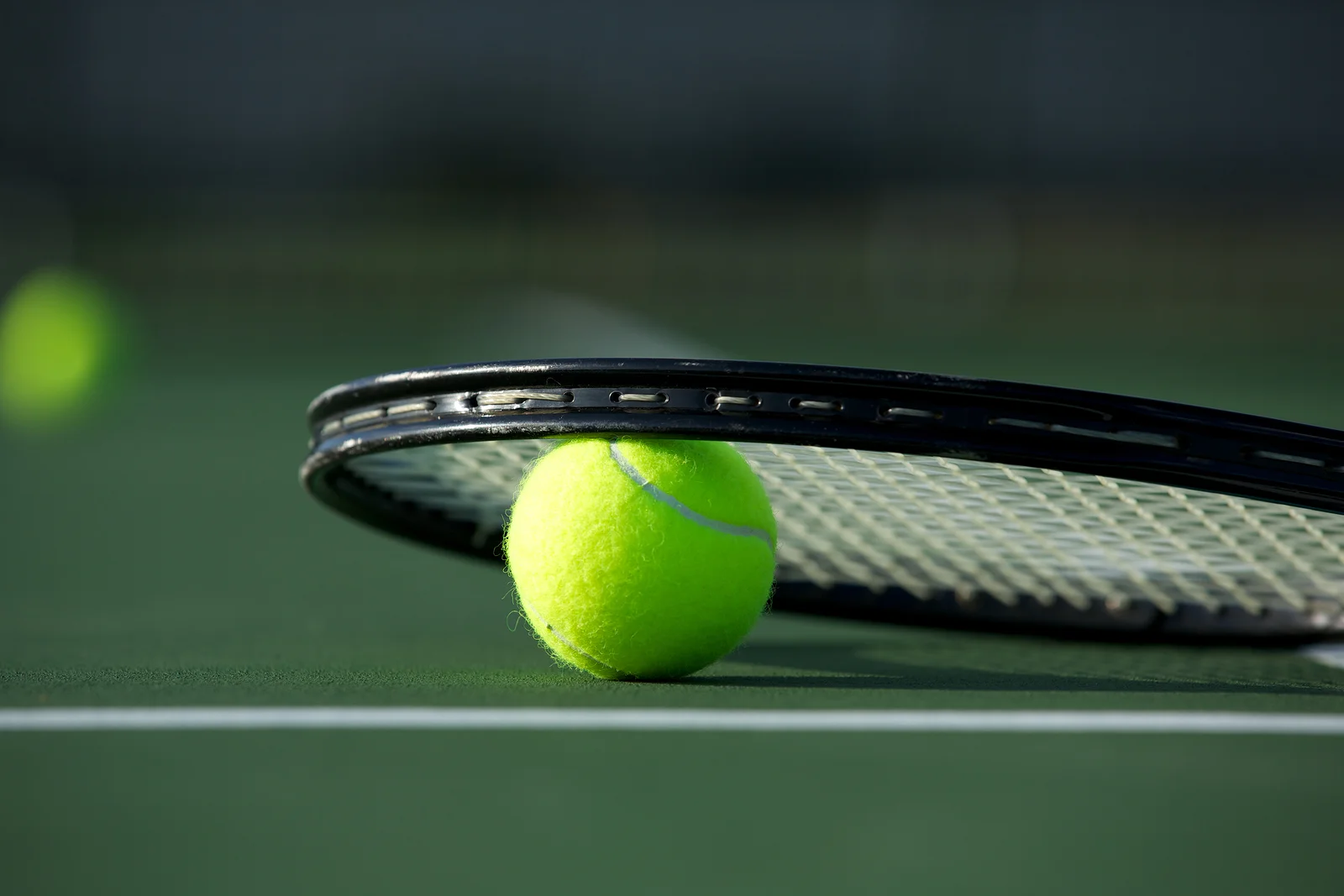 bigstock-Tennis-Ball-and-Racket-on-the--46288372.jpg