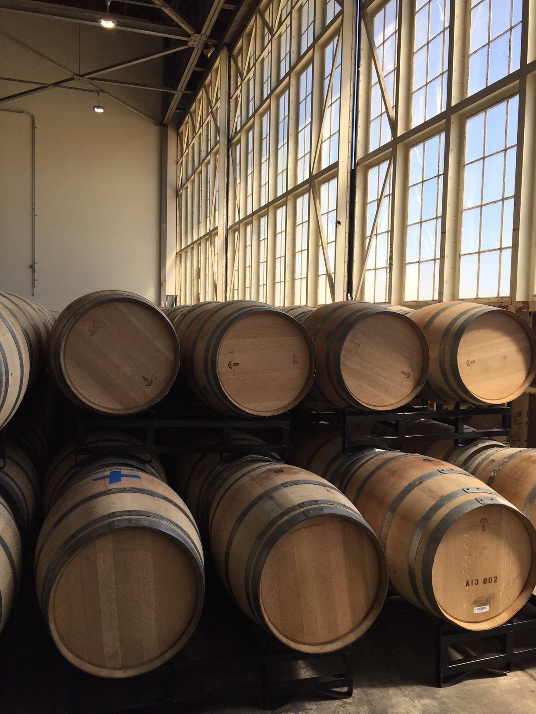 Oak barrels stacked at Hangar 1 Distillery 