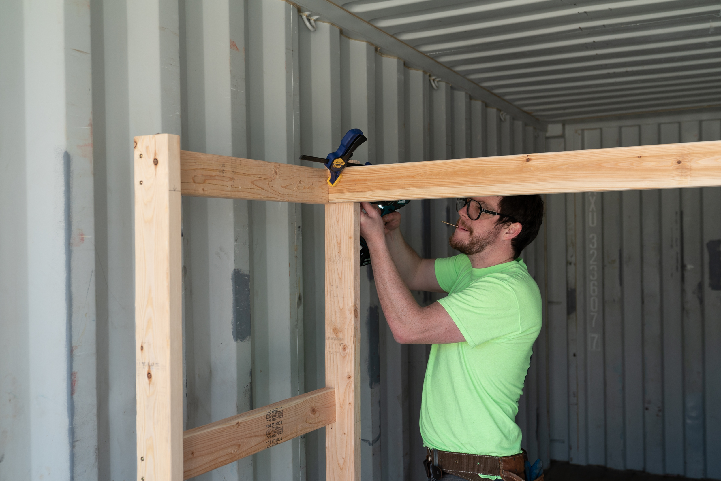 Stephen helps build out shipping containers for bike rentals and storage. 