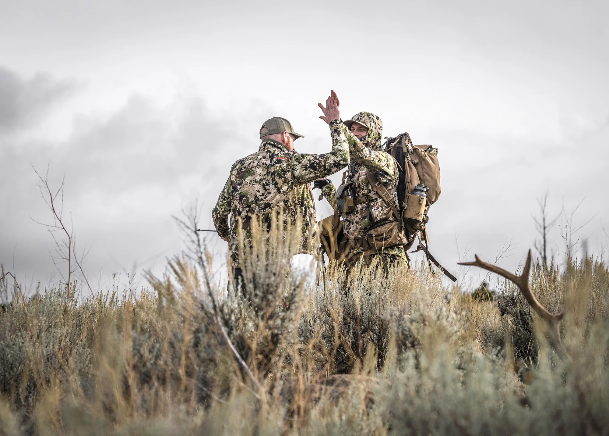 Casey Harbertson of MTN Ops celebrates a successful harvest with Garrett Hilbert .