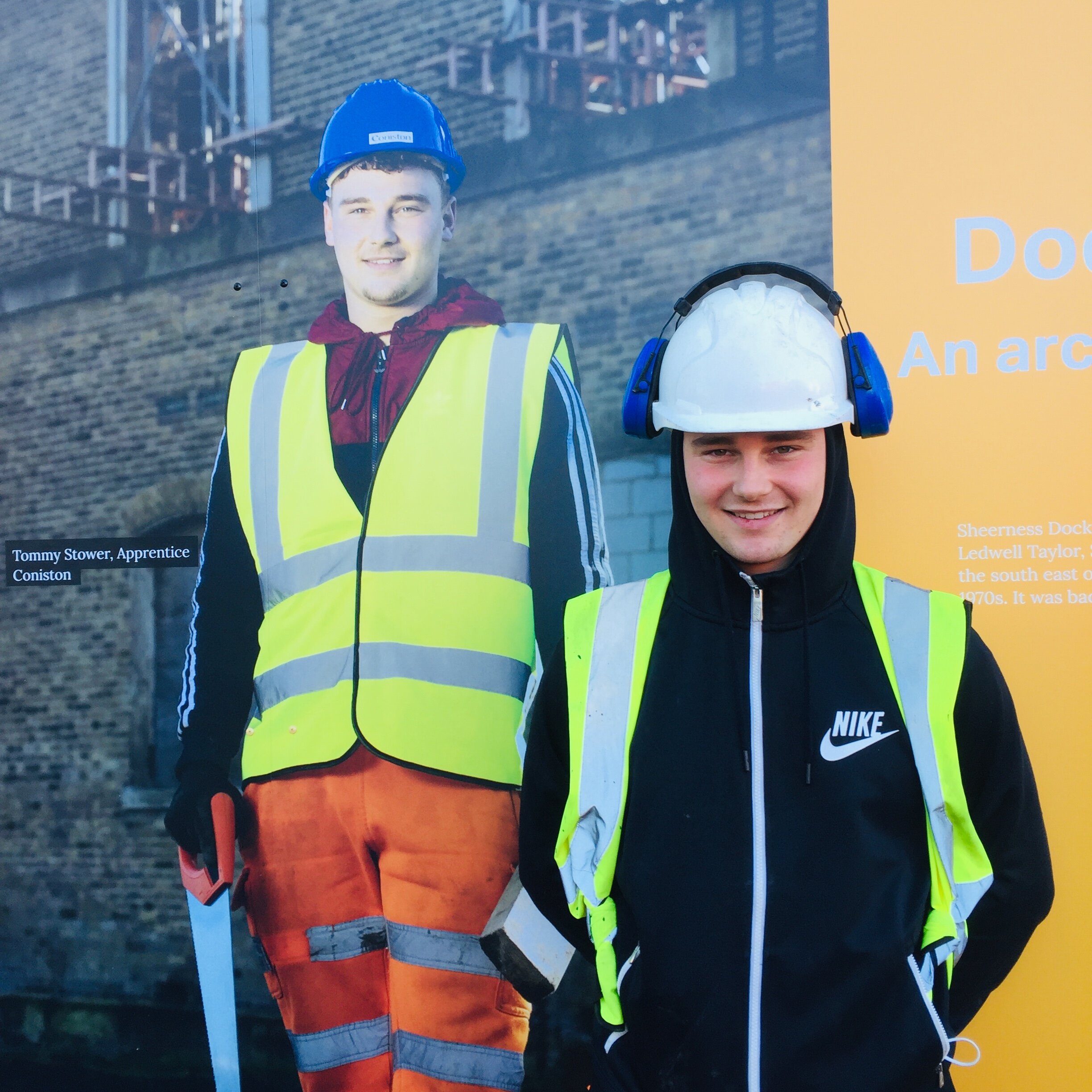 Coniston apprentice Tommy Stower in front of his portrait.jpeg