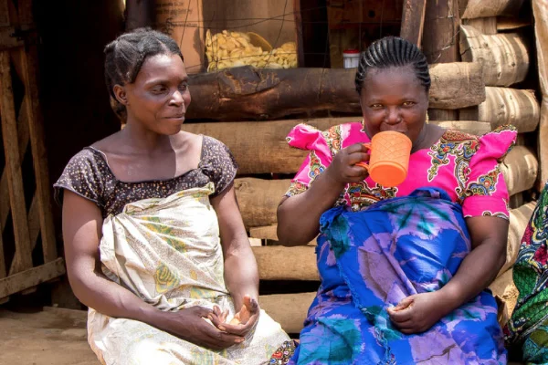 Enjoying chai outside a small business in Isopilo, Tanzania