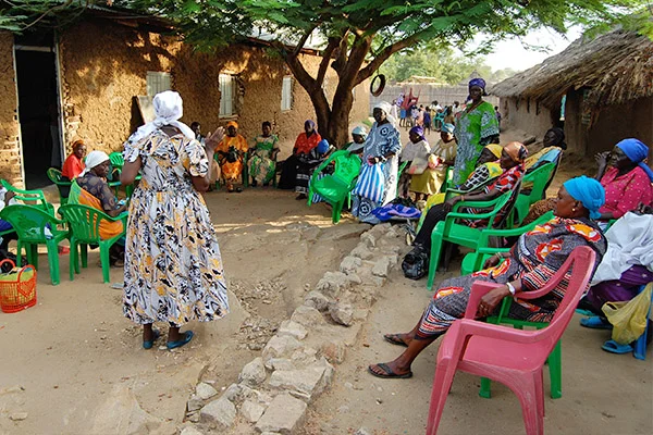 Above: Women gather during a savings group meeting in South Sudan.